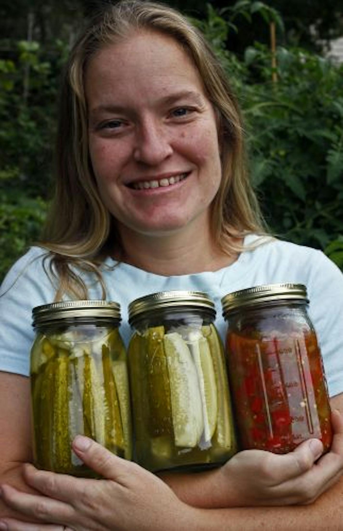 Catrina Mujwid-Cole with some of the produce she preserved from her garden.