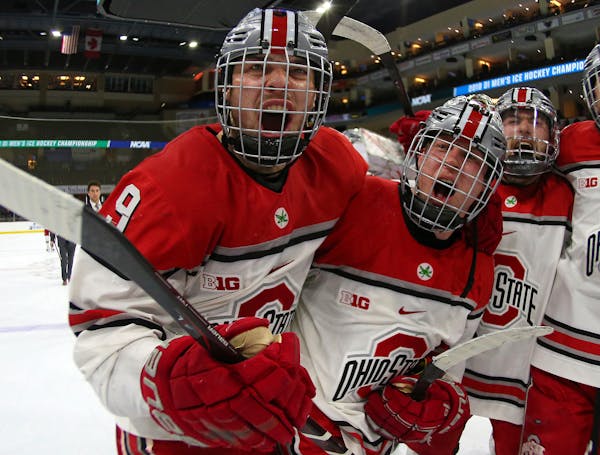 Ohio State forwards Tanner Laczynski (9) and Ronnie Hein celebrated the Buckeyes' 5-1 victory over Denver in the NCAA Midwest Regional final on Sunday