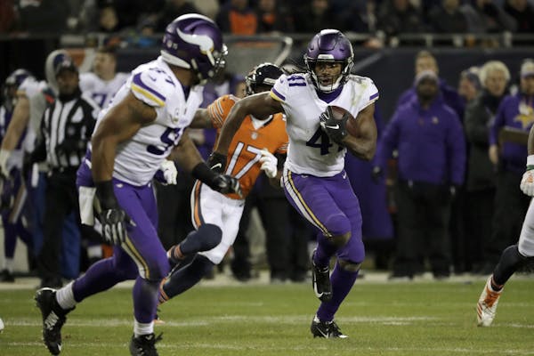 Minnesota Vikings defensive back Anthony Harris (41) runs after intercepting a pass during the second half of an NFL football game against the Chicago