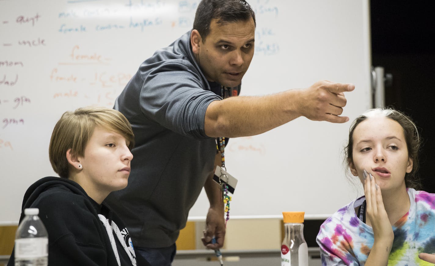 Ryan Dixon taught a lesson on how to say pronouns like little sister and older brother from the perspective of a male and female during a high school Dakota language class at the Lower Sioux Historical Site in Morton, Minn., on Friday, October 12, 2017. Two of his students, Tylar Larsen, 16, (left) and Emmarica Larsen, 15, (his daughter), are pictured. ] RENEE JONES SCHNEIDER &#x2022; renee.jones@startribune.com *avoid using pronouns for Tylar as I believe Tylar may identify as male but am not s