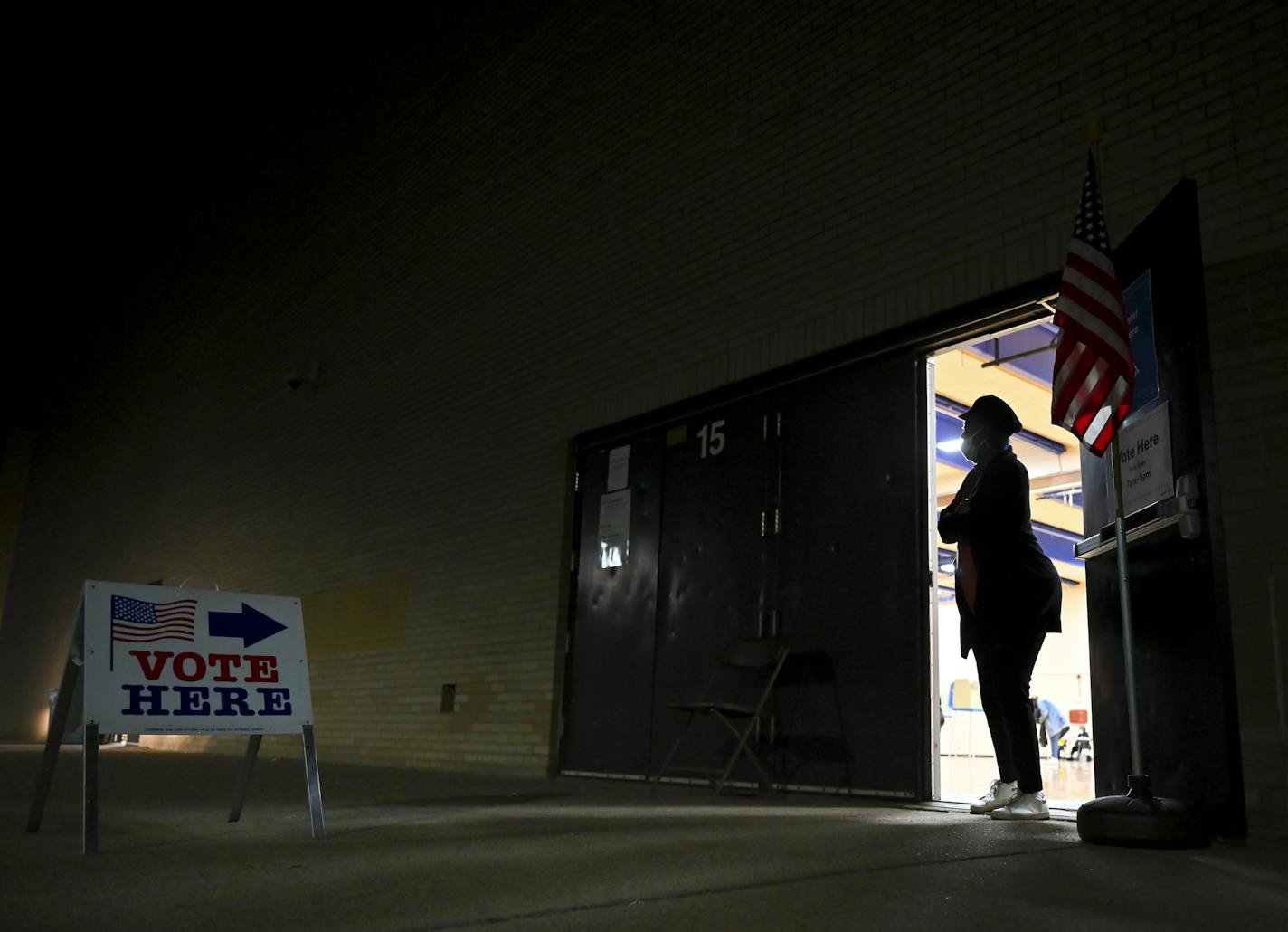 Tamara, no last name given, an election judge at North High School, looked outside for voters Tuesday night at North High School. ] AARON LAVINSKY • aaron.lavinsky@startribune.com Election day photos taken Tuesday, Nov. 3, 2020 in Minneapolis, Minn.