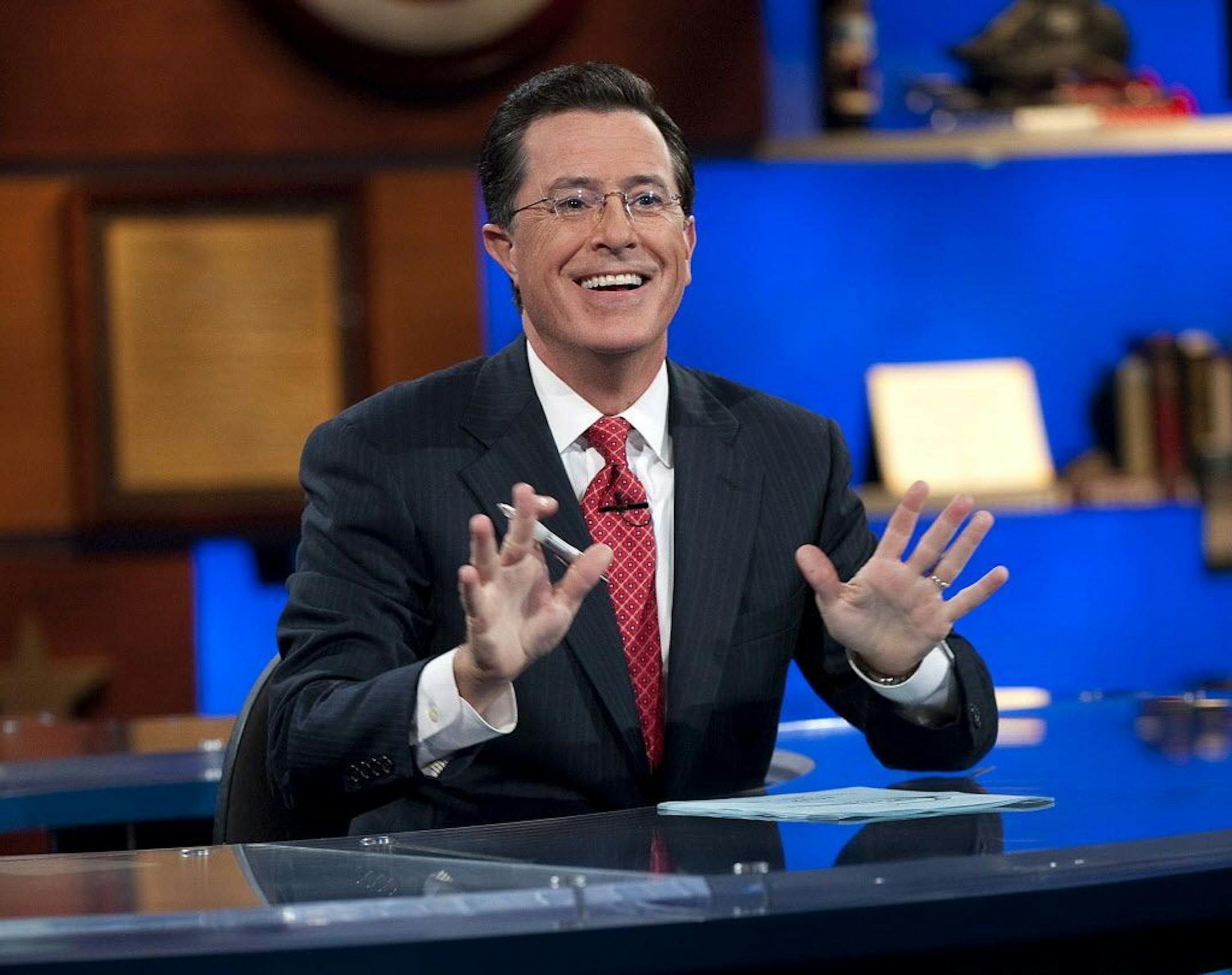 This Sept. 8, 2010 publicity photo released by Comedy Central shows host Stephen Colbert appears on "The Colbert Report," in New York. "The Colbert Report" will end on Thursday, Dec. 18, 2014, after nine seasons.