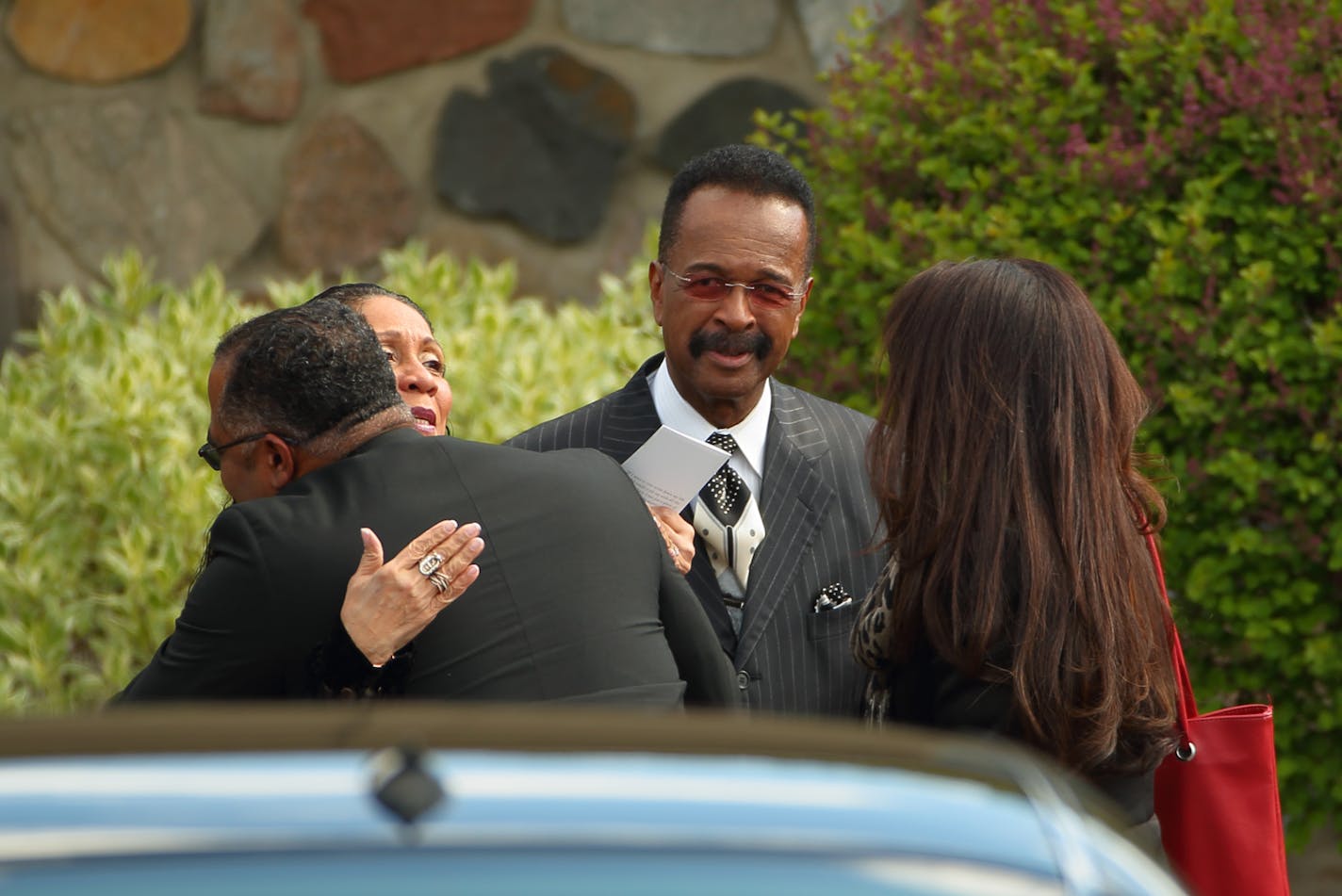 Larry Graham, center, arrived at the Kingdom Hall for the memorial service. According the program, he was one of two people who spoke. ] JEFF WHEELER &#xef; jeff.wheeler@startribune.com Members of Prince's Jehovah's Witness Kingdom Hall congregation held a private memorial service for him Sunday afternoon, May 15, 2016 at the Kingdom Hall in Hopkins.