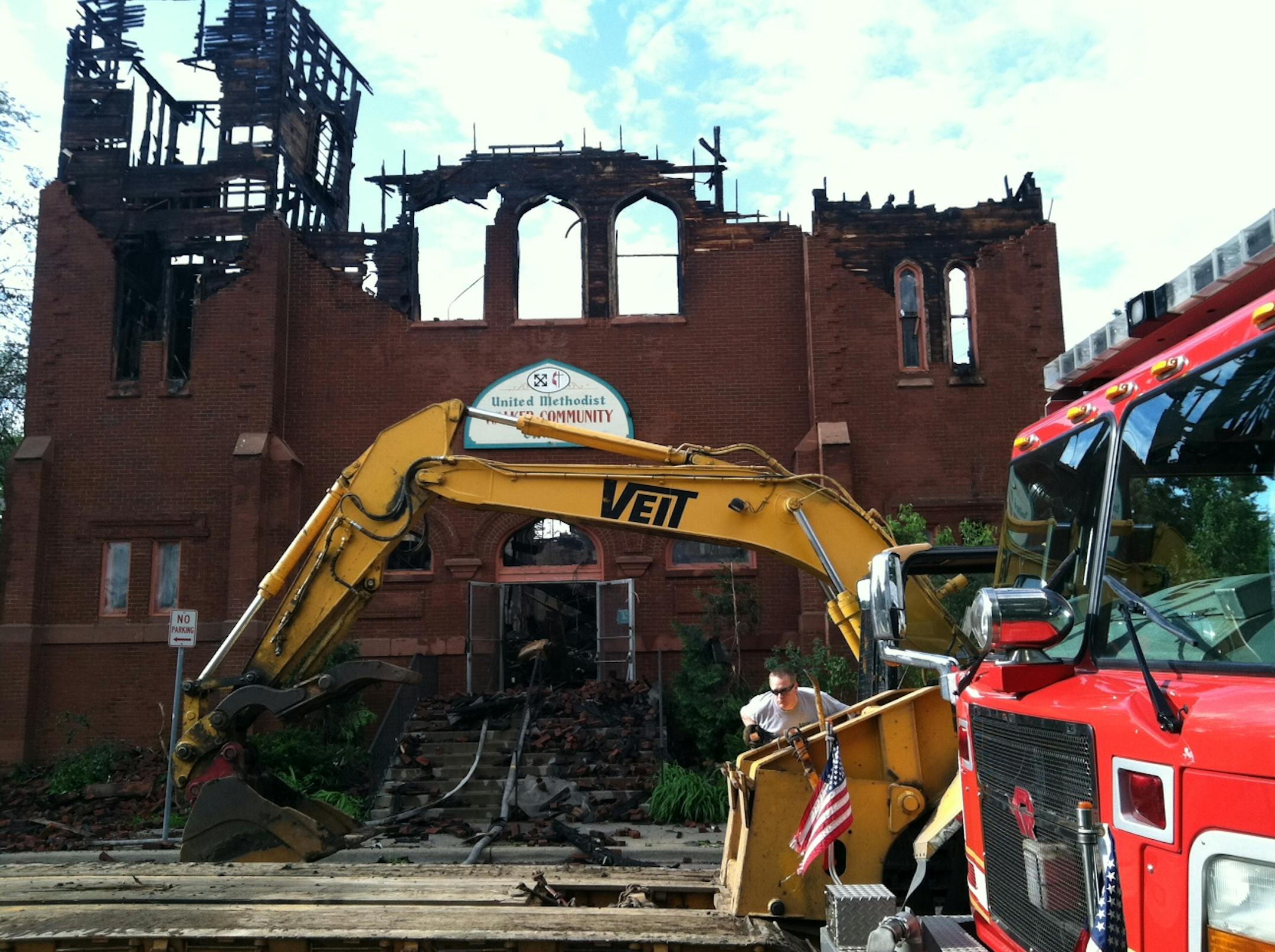 Authorities examine the fire's wreckage at Walker Community United Methodist Church, 3104 16th Ave. S. in Minneapolis.