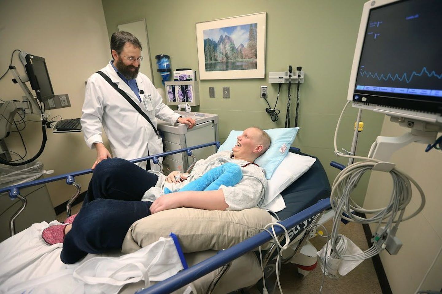 Acupuncture Specialist Adam Reinstein met with cancer patient Julie Valley before giving her an acupuncture treatment at the Abbott Northwestern emergency room, Monday, March 7, 2016 in Minneapolis, MN. The hospital is reporting success posting an acupuncturist in its ER to provide pain relief to patients.