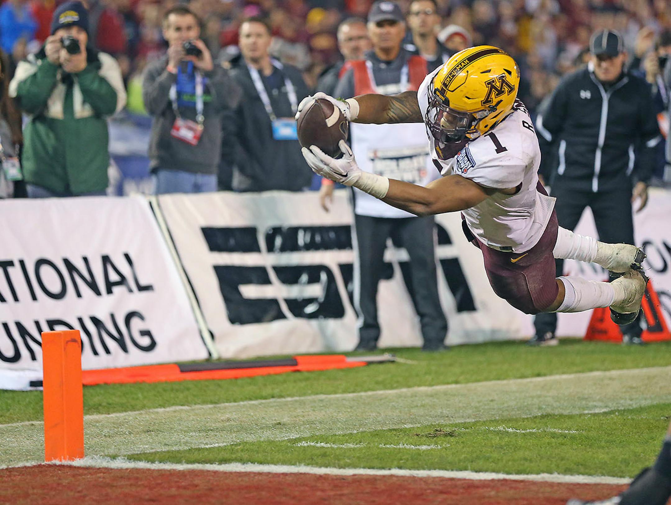 Minnesota's running back Rodney Smith jumped into the end zone for a touchdown during the first fourth quarter as they took on Washington State at Qualcomm Stadium for the San Diego Holiday Bowl, Tuesday, December 27, 2016 in San Diego, CA.