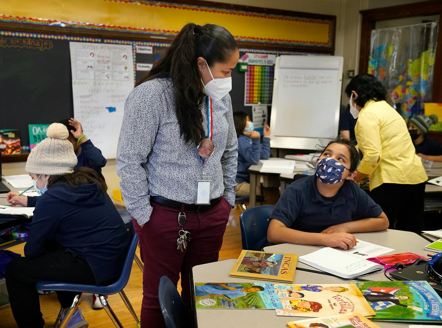 Principal speaks with a student