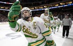 Mason Nevers (18) of Edina prepared to celebrate with teammates on the bench after scoring a goal in the first period. ] CARLOS GONZALEZ • cgonzalez