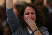 A woman tried to hold back tears as she listened to President-elect Barack Obama's acceptance speech Tuesday night. She was one of hundreds of DFLers 