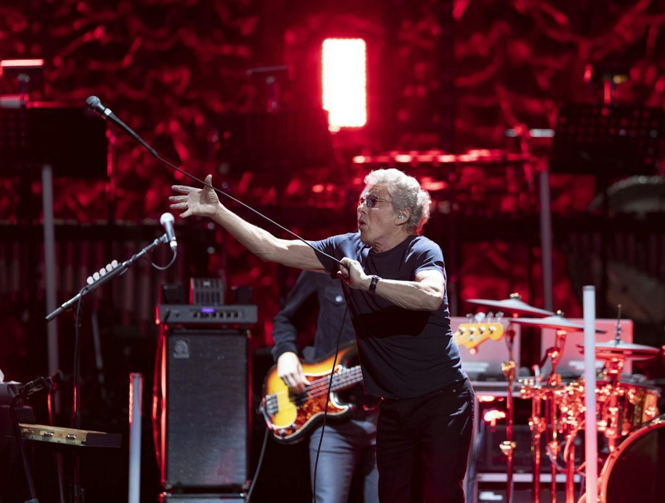Lead singer Roger Daltrey reigned in his microphone during Amazing Journey early in The Who's show at Xcel Friday night.