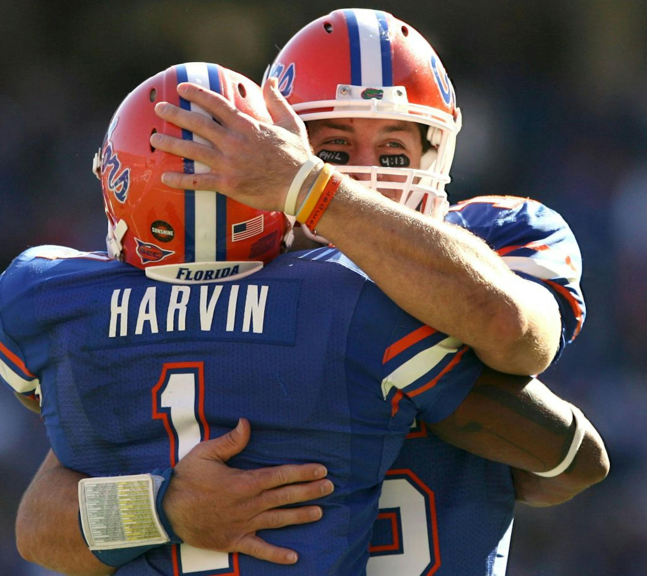 Florida quarterback Tim Tebow congratulates wide receiver Percy Harvin after a touchdown against Citadel at Florida Field in Gainesville, Florida, on Saturday, November 22, 2008. Florida won 70-19.