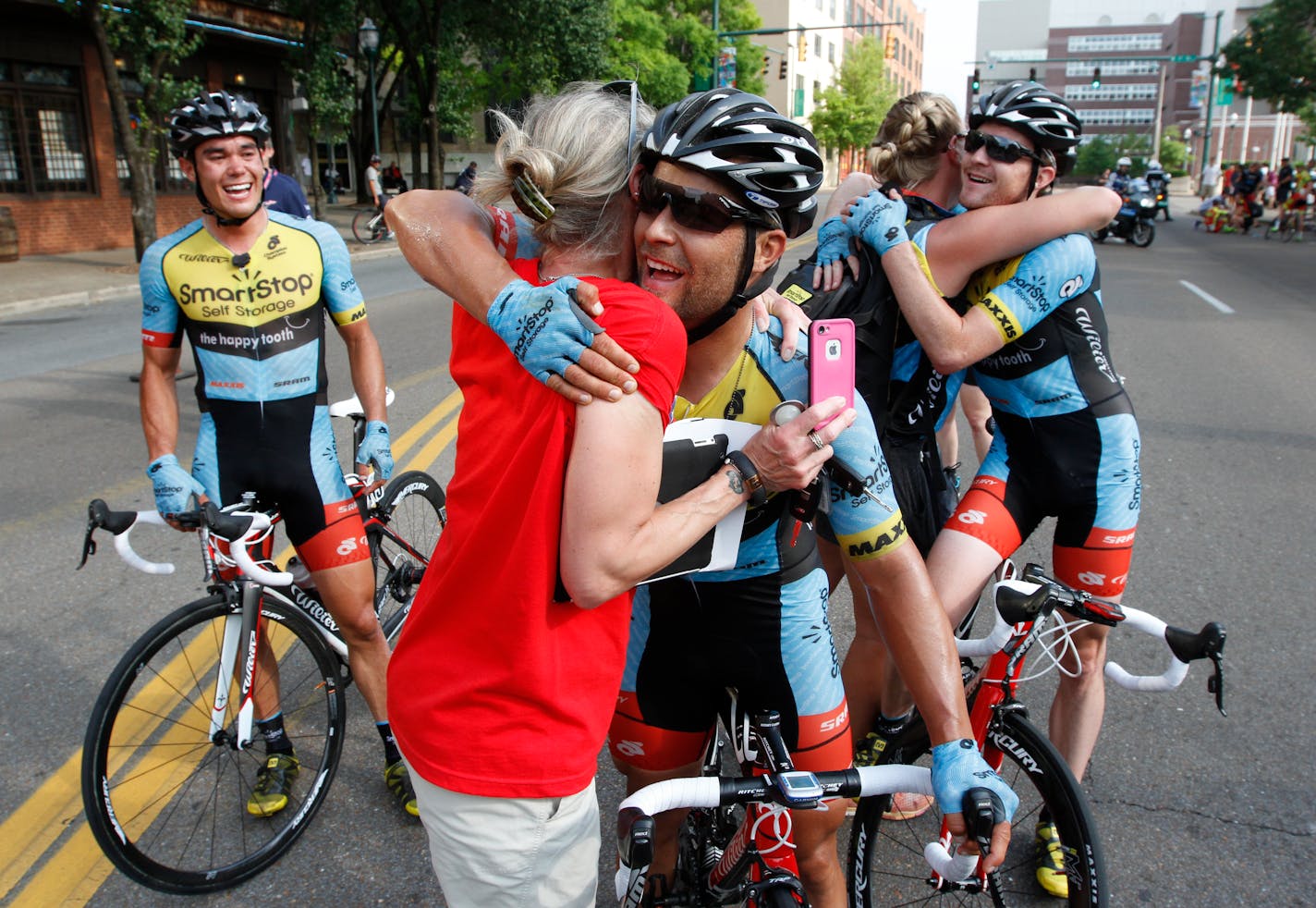 Eric Marcotte, center, and received congratulations on winning the USA Cycling Road Race National Championship on May 26, 2014, In Chattanooga.