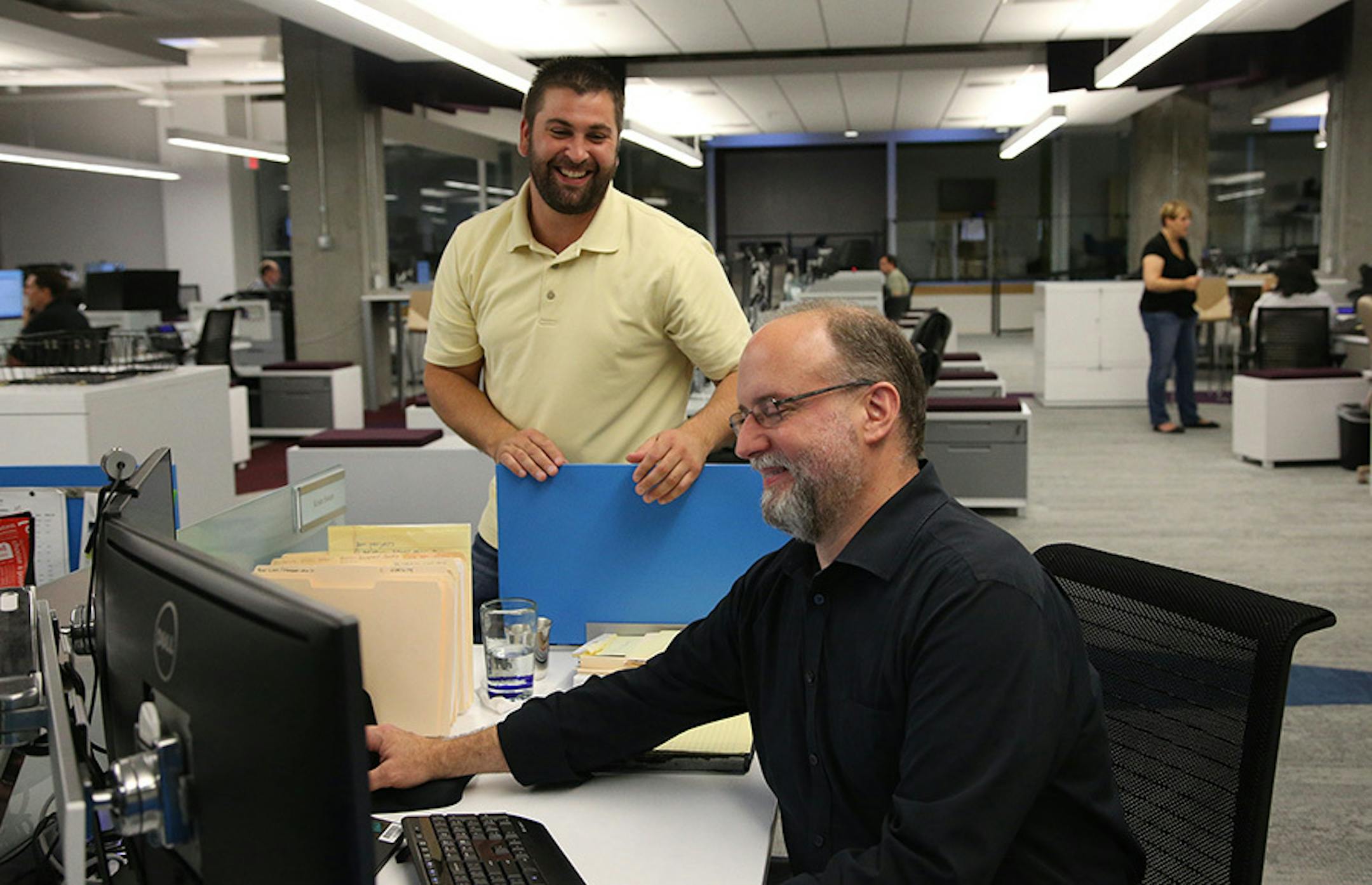 Jaime Baker, standing, joked around with Kristo Sween on the newly redesigned fourth floor.