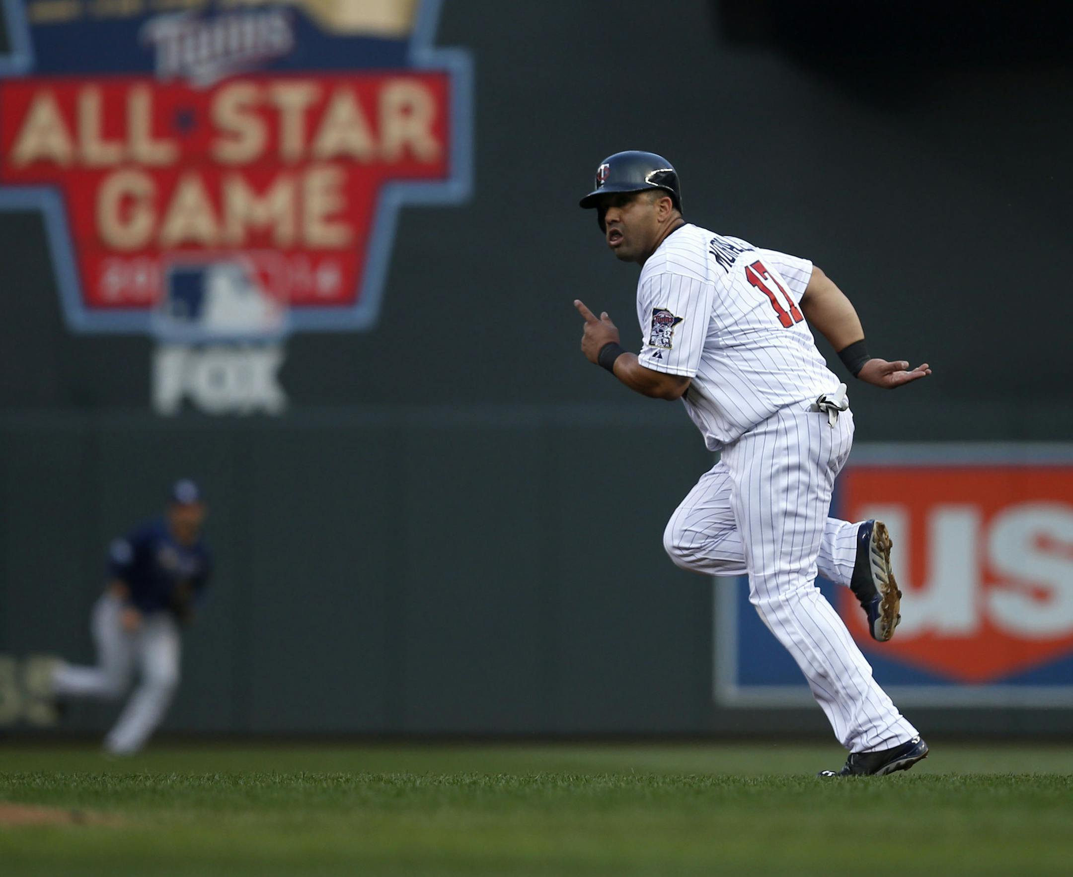 Kendrys Morales of the Twins runs towards second base during the first inning of the game against the Tampa Bay Rays on Friday afternoon. This is the Twins first game at Target Field since the All-Star Game earlier this week. ] The Minnesota Twins take on the Tampa Bay Rays on Friday night at Target Field. MONICA HERNDON monica.herndon@startribune.com Minneapolis, MN 07/18/14