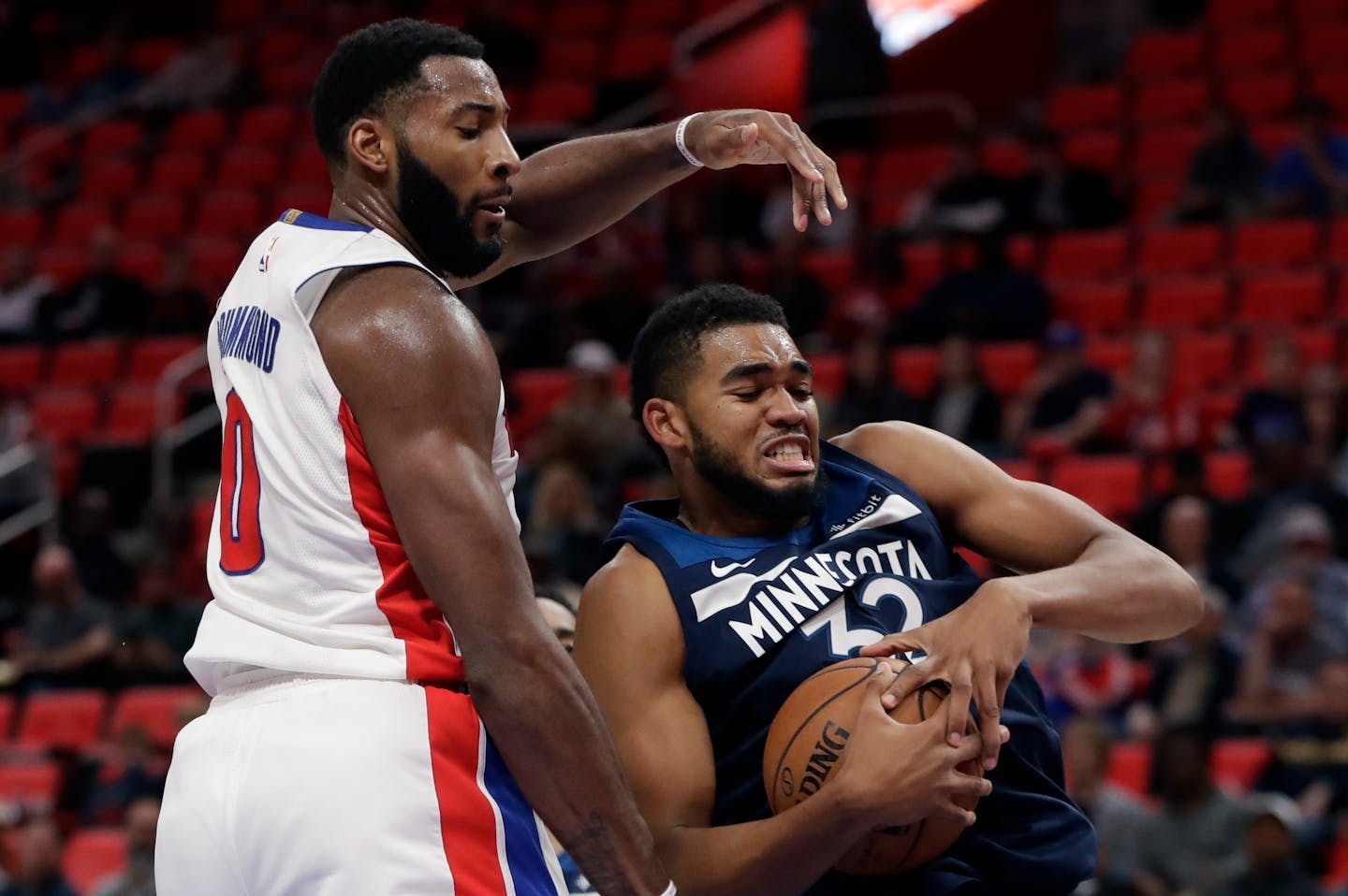 Minnesota Timberwolves forward Anthony Brown (3) grabs a rebound in front of Detroit Pistons center Andre Drummond (0) during the first half of an NBA basketball game, Wednesday, Oct. 25,2017, in Detroit. (AP Photo/Carlos Osorio)