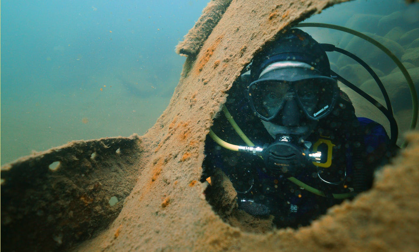 Jack Decker, a diver with the Great Lakes Shipwreck Preservation Society from Clear Lake, Iowa, peered through a hawse hole on the Madeira. ] ANTHONY SOUFFLE &#x2022; anthony.souffle@startribune.com The scuba divers of the Great Lakes Shipwreck Preservation Society dove the two most accessible shipwrecks, the Hesper, a bulk-freighter steamship that sank in Lake Superior on May 4, 1905 off Silver Bay and the Madeira, a schooner barge that sank in Lake Superior on November 28, 1905 near Split Rock