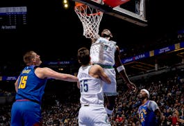 The Timberwolves' Anthony Edwards dunks the ball against the Nuggets in the first quarter Tuesday at Target Center.