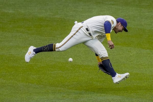 Milwaukee Brewers' Avisail Garcia can't catch a ball hit by Minnesota Twins' Mitch Garver during the second inning of a baseball game Wednesday, Aug. 