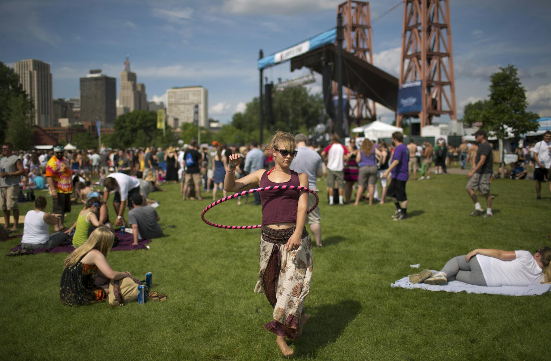 The inaugural River's Edge Music Festival continued for it's second day Sunday, June 24, 2012 under sunny skies on Harriet Island in St. Paul, Minn. Michelle Anthony of Eau Claire danced to Polica as they performed on the Chipotle stage at rear Sunday afternoon. ] JEFF WHEELER &#x201a;&#xc4;&#xa2; jeff.wheeler@startribune.com ORG XMIT: MIN2013062115383373 ORG XMIT: MIN1306211542009426