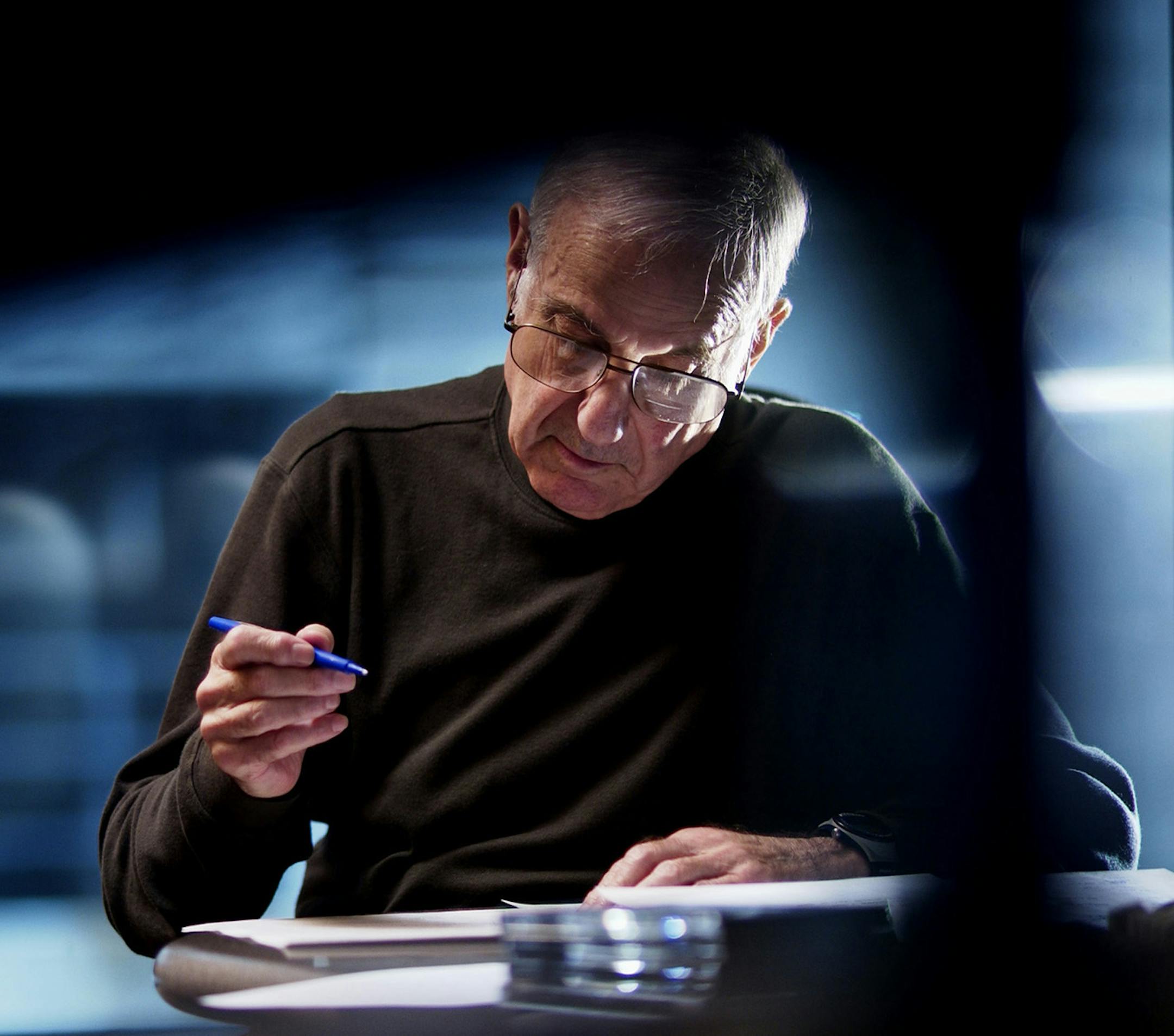 SAT_07/20/02_St.Paul - - - - - - Leigh Kamman goes over the Jazz Image shows music list with engineer Sam ____ before going on air.