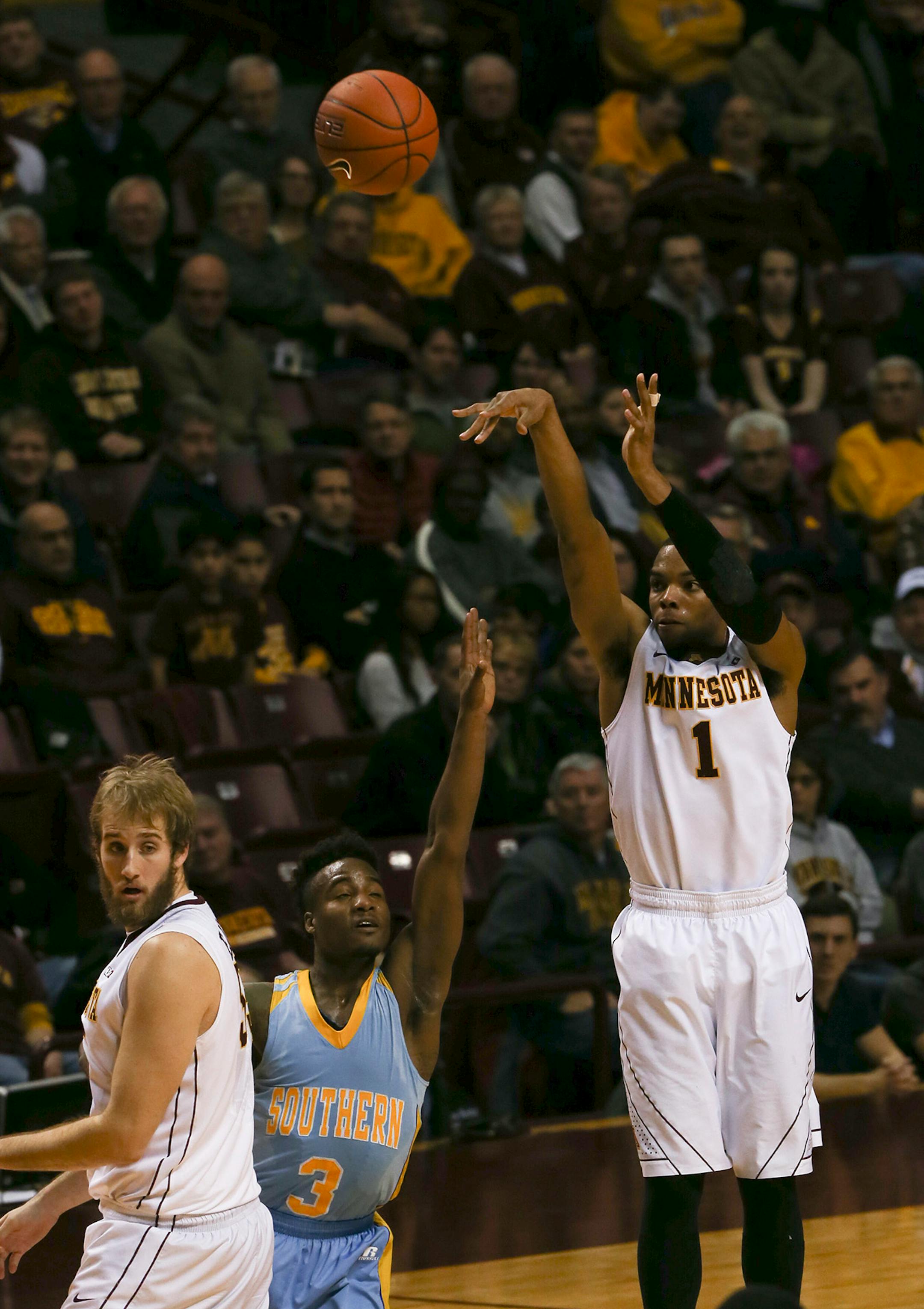 Gophers guard Andre Hollins (1) took a three point shot in the first half Wednesday night at Williams Arena. He finished with 24 points for the night. ] JEFF WHEELER • jeff.wheeler@startribune.com The University of Minnesota men's basketball team trounced Southern University 85-57 at Williams Arena Wednesday night, December 10, 2014 in Minneapolis.