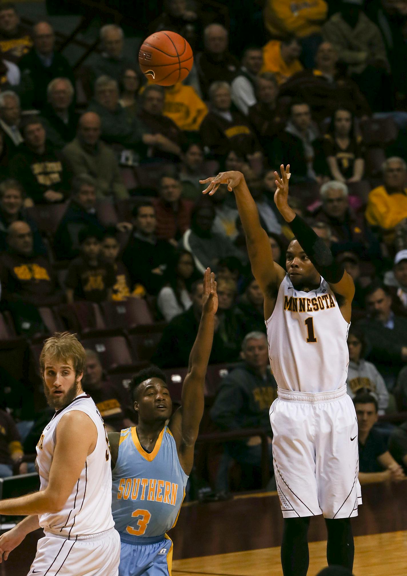 Gophers guard Andre Hollins (1) took a three point shot in the first half Wednesday night at Williams Arena. He finished with 24 points for the night. ] JEFF WHEELER • jeff.wheeler@startribune.com The University of Minnesota men's basketball team trounced Southern University 85-57 at Williams Arena Wednesday night, December 10, 2014 in Minneapolis.