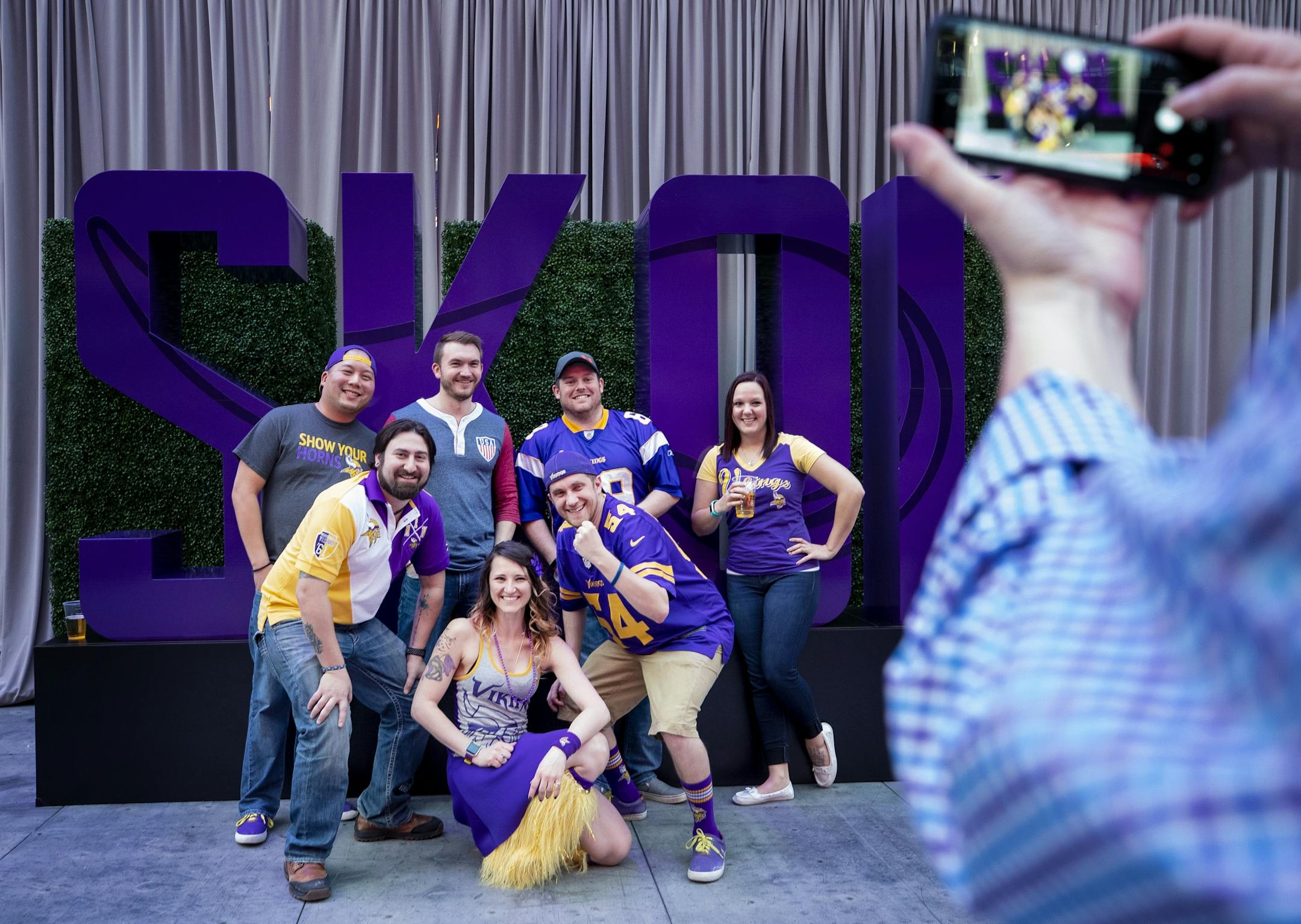 Fans posed for a photo at the Minnesota Vikings draft party held at US Bank Stadium.