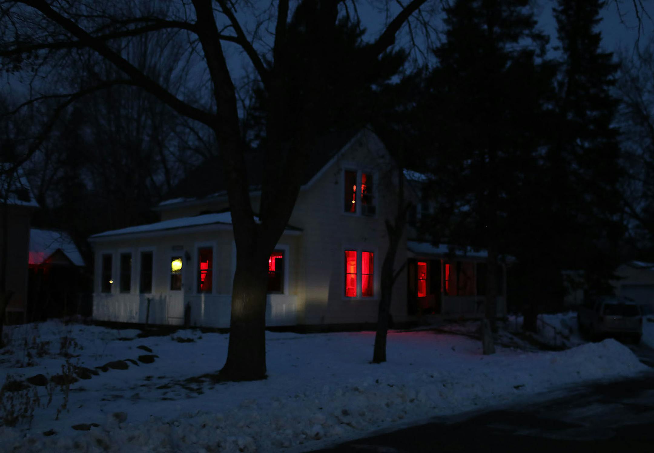 Thaddeus Owen and fianc� Heidi Sime's house is bathed in red light before dawn.