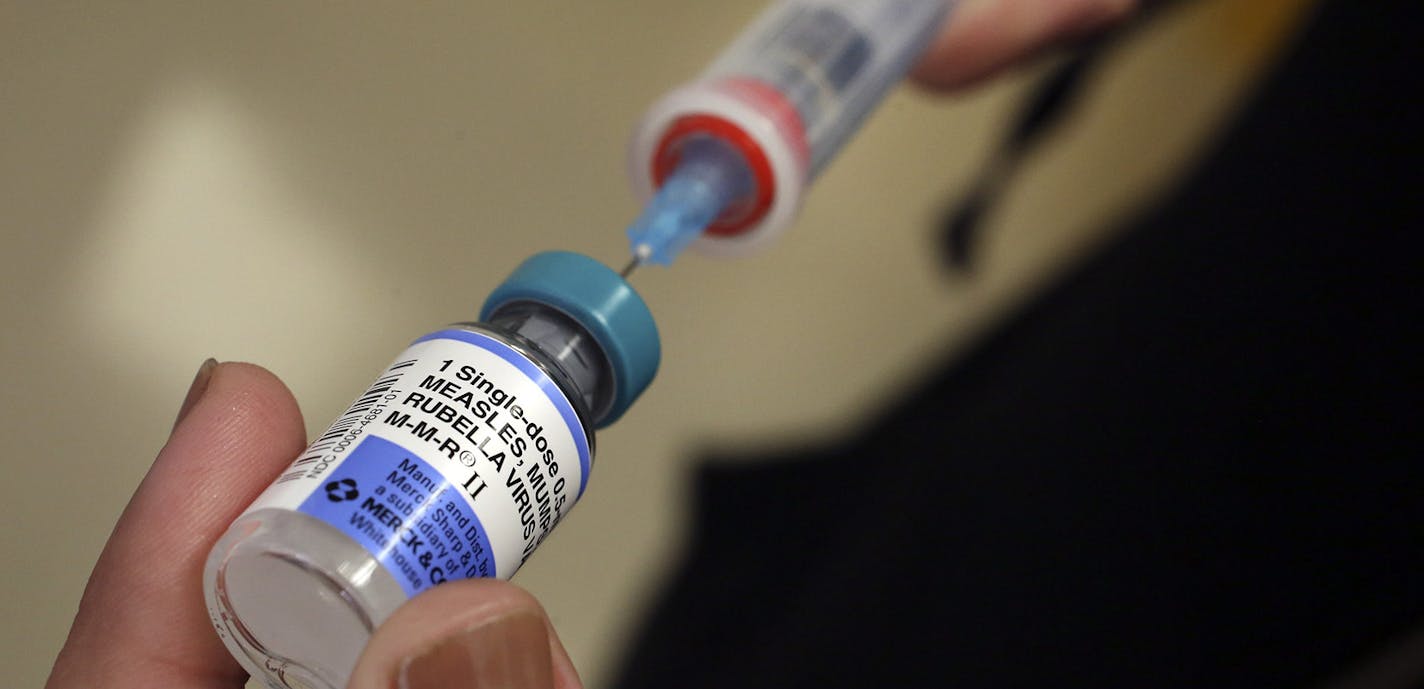 A vial containing the MMR vaccine is loaded into a syringe before being given to a baby at the Medical Arts Pediatric Med Group in Los Angeles on February 6, 2015. (Mel Melcon/Los Angeles Times/TNS) ORG XMIT: 1265357