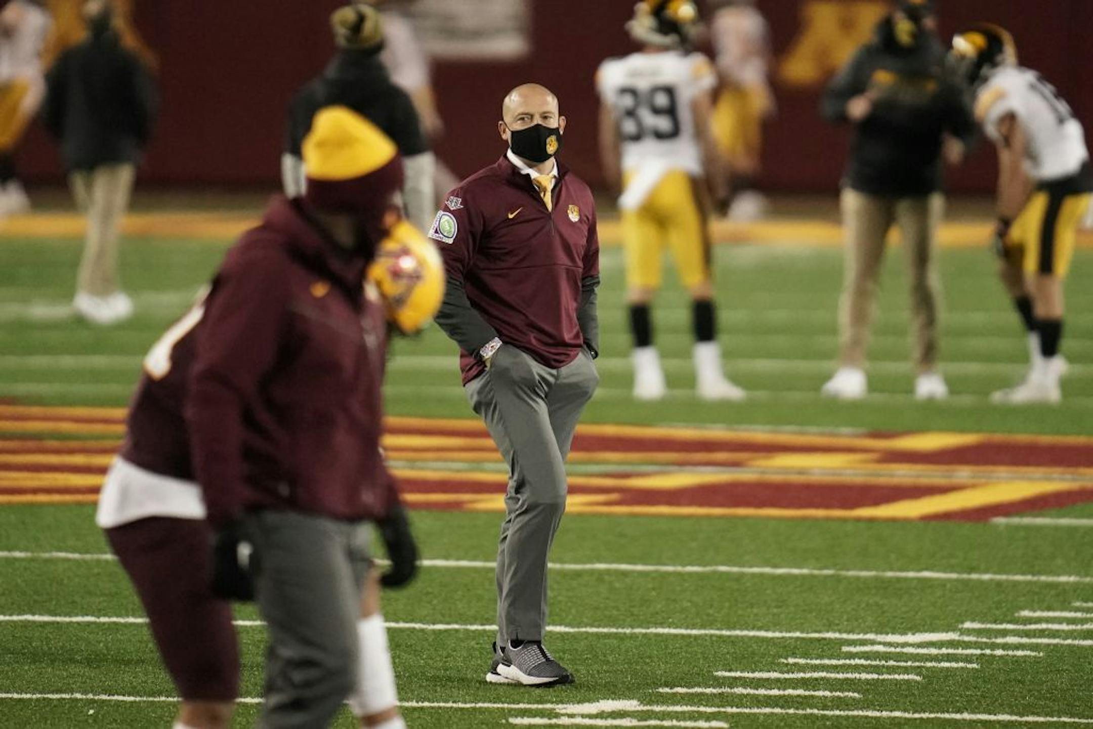 Minnesota Gophers head coach P.J. Fleck watched his players warm up before the game.