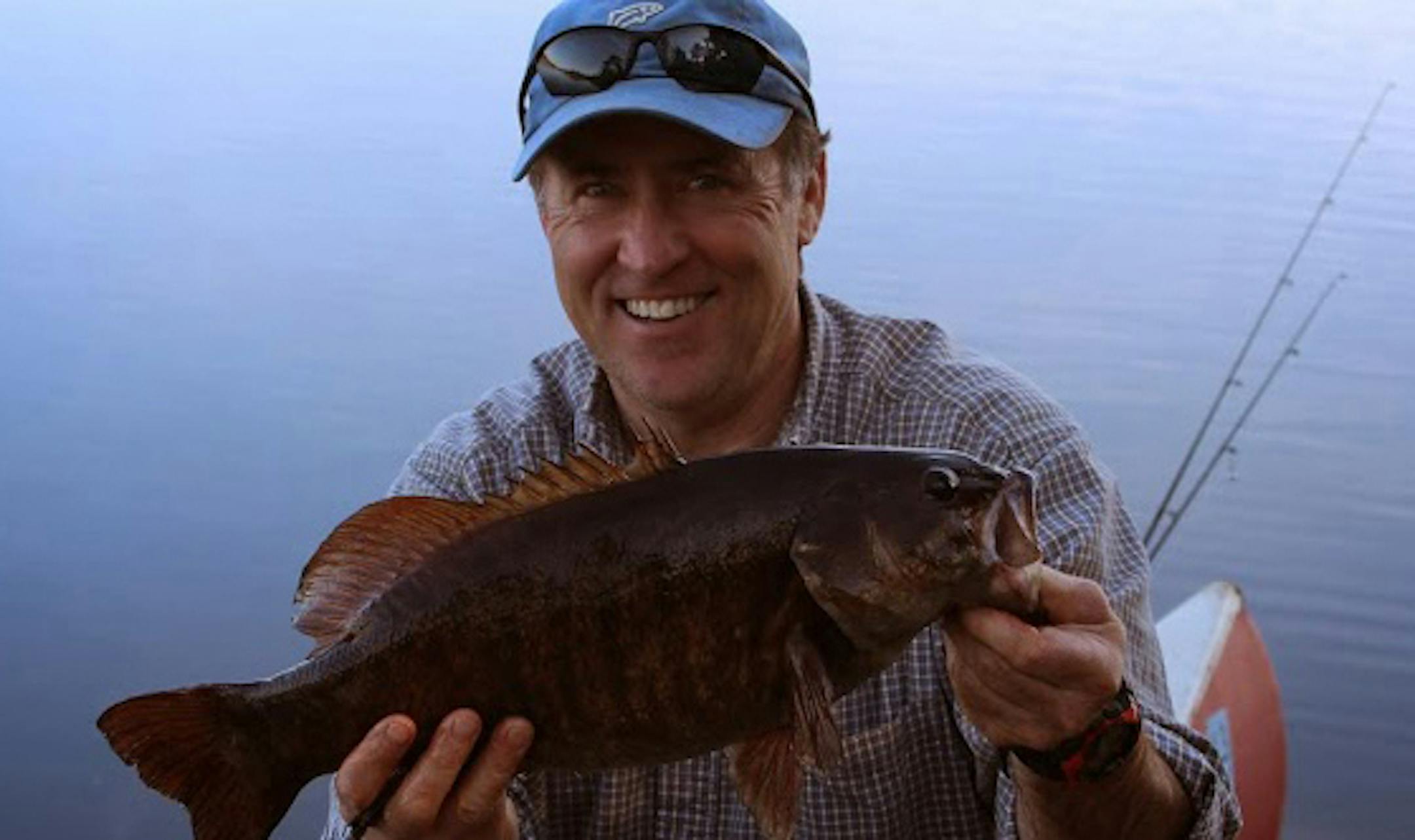 Tim McMullen of Delano with a 20 3/4-inch smallmouth bass he caught in the Boundary Waters Canoe Area Wilderness. Though many BWCA lakes were ice-covered, McMullen and his son found open water -- and good fishing -- on the Kawishiwi River.