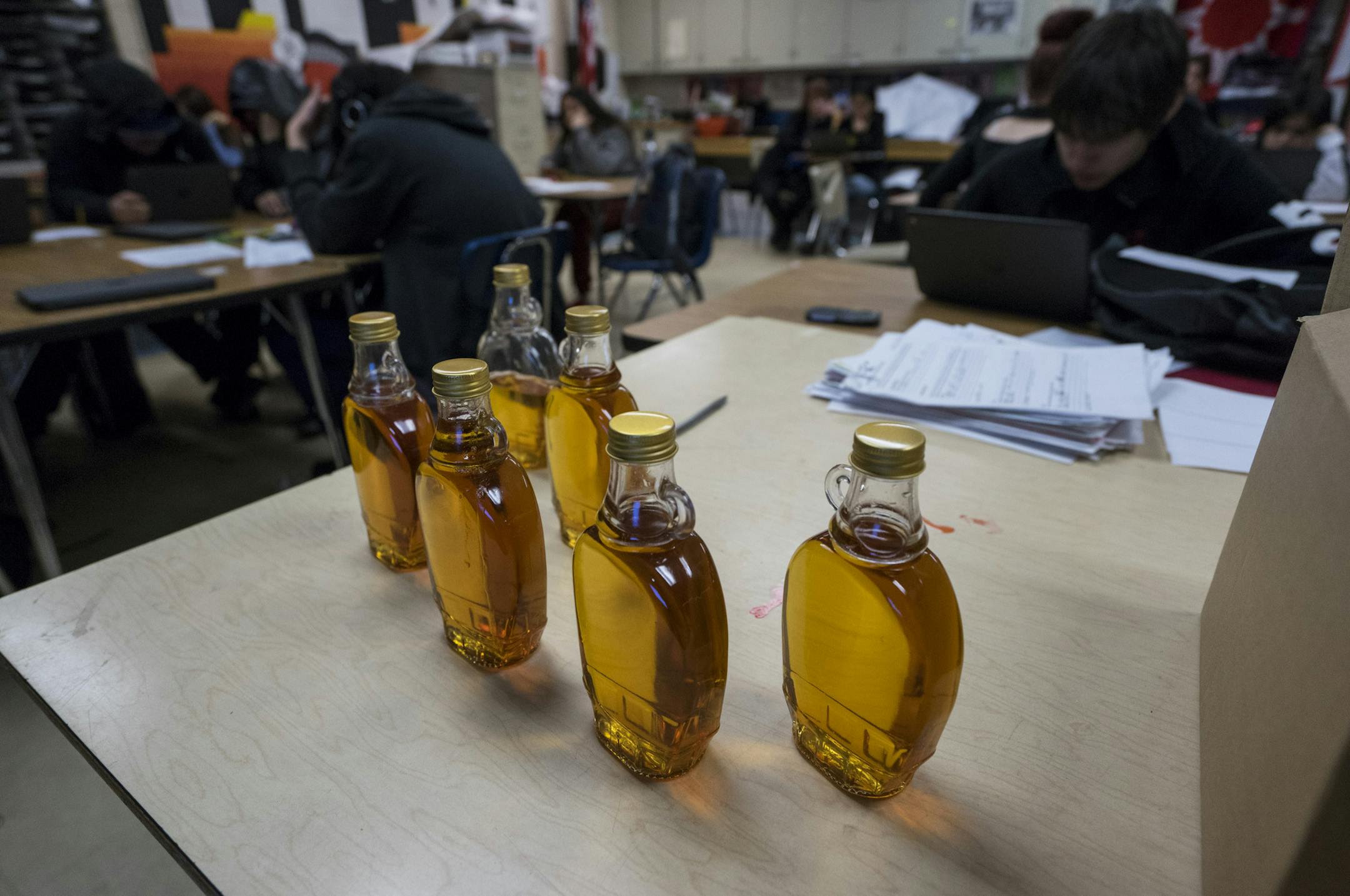 Maple syrup made by students in Vince Patton's 10th grade U.S. history class sits on a table at South High School in Minneapolis on Thursday, March 28, 2019.]
TONY SAUNDERS &#xb0; anthony.saunders@startribune.com Patton, of the Oglala Sioux tribe shows his mostly Native American class how to tap maple trees, collect sap, and turn it into maple syrup. Last year, the class had to work out an issue with the city, as it is illegal to tap trees that belong to the city. But Patton and his students wer