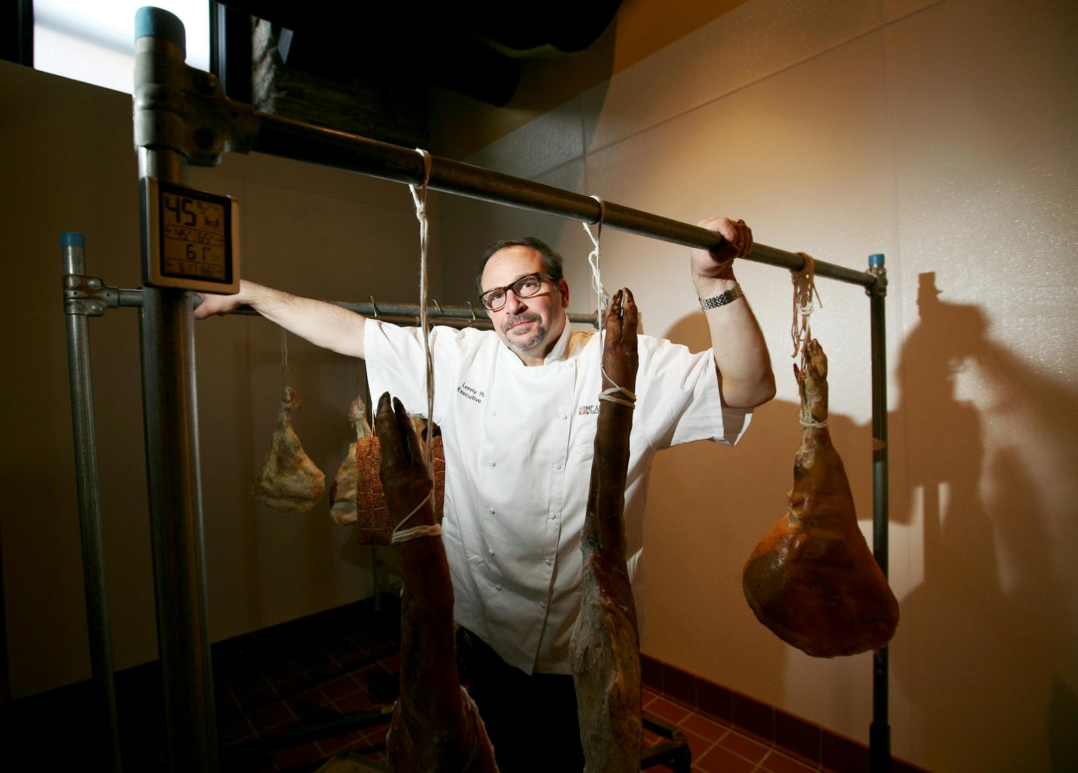 Lenny Russo, chef and proprietor of Heartland Restaurant & Farm Direct Market in St. Paul, has meats in his curing room that are 2 and 3 years old. Photographed in Heartland's curing room May 11, 2013. (Courtney Perry/Special to the Star Tribune)