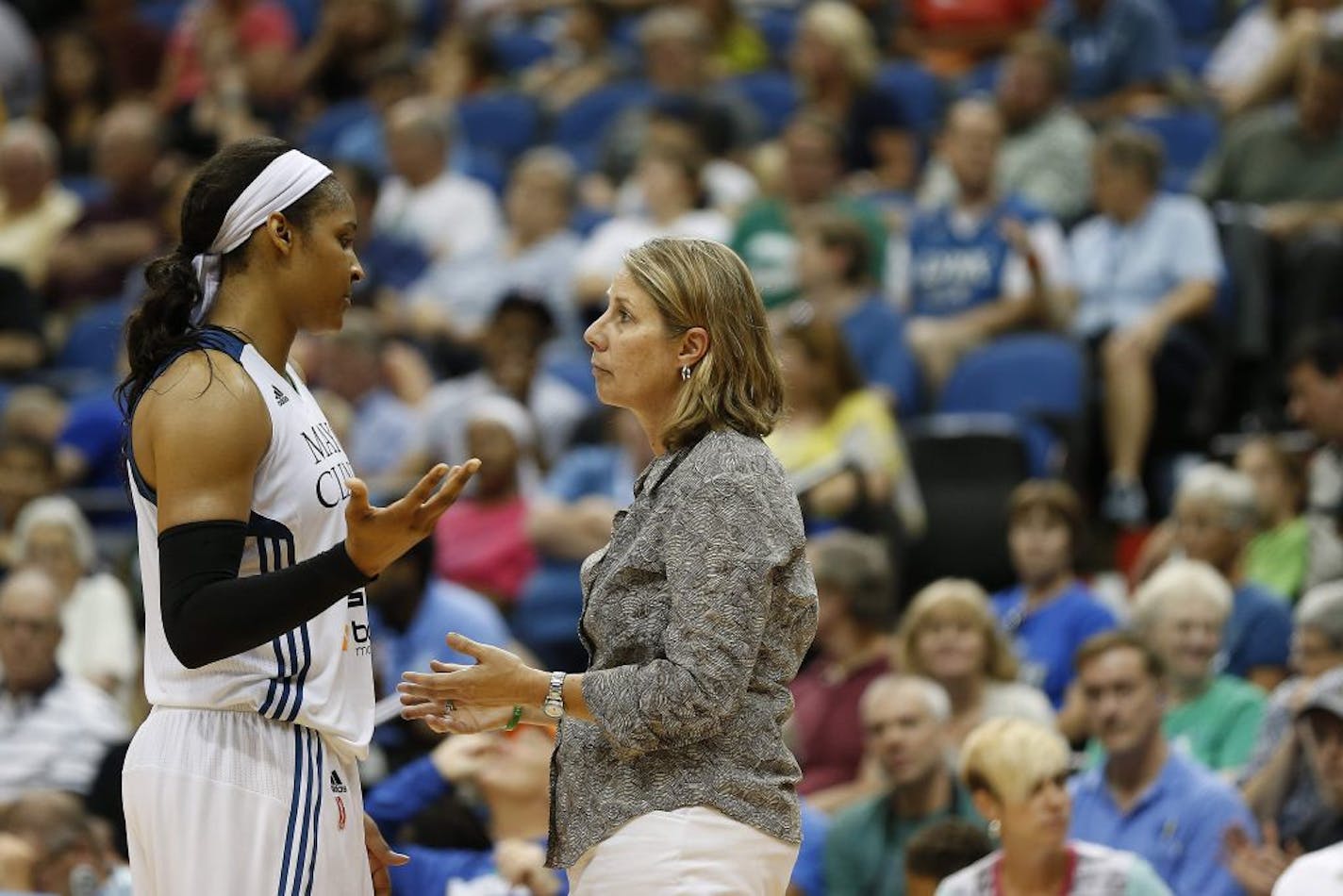 Minnesota Lynx forward Maya Moore (23) talks with head coach Cheryl Reeve during the second half of a WNBA basketball game against the Connecticut Sun, Wednesday, July 22, 2015, in Minneapolis. The Sun won 78-77 in overtime.