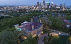 Aerial view of the home set against the downtown Minneapolis skyline.