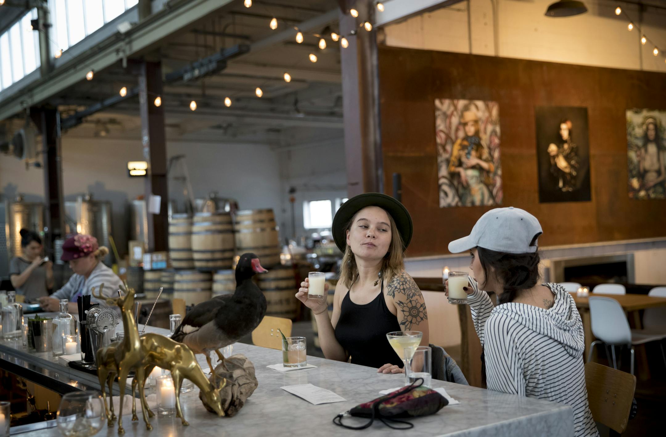 Corrin Turkowitch and Sophie Gori took sips from a frozen mixed drink at Norseman Distillery.