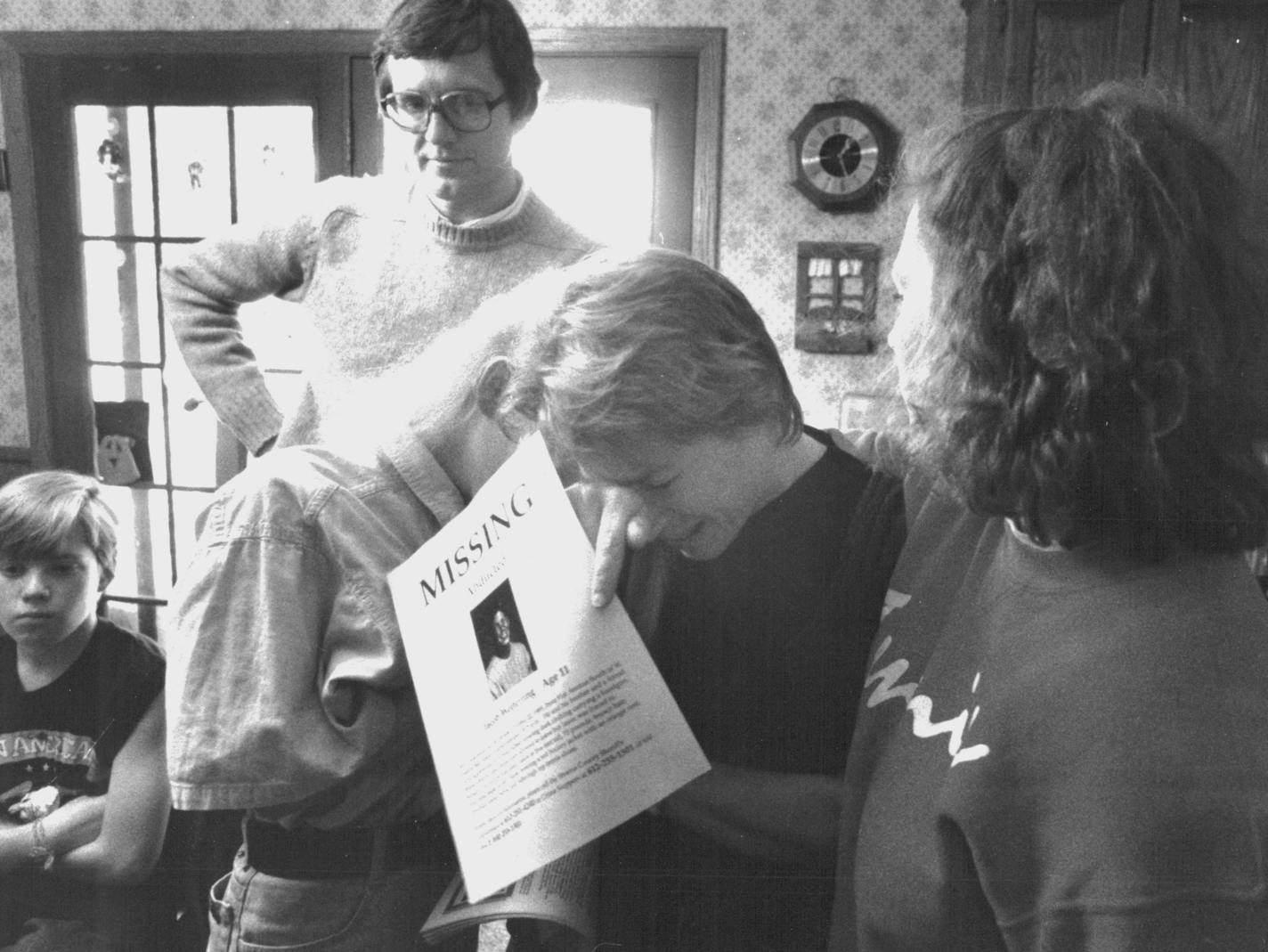 October 23, 1989 Jerry Wetterling watches in dispair as his wife Patty breaks down in tears upon seeing the missing persons poster of their adducted 11-year-old son Jacob that volunteers began spreading throughout the state and nation Monday afternoon. Jacob was abducted from a country road near his home at 29422 Kiwi Court in St. Joseph, MN at about 9:15 Sunday evening. (The two young women comforting Mrs. Wetterling are Shannon Brannan, right, a former foster daughter of the Wetterlings and Li