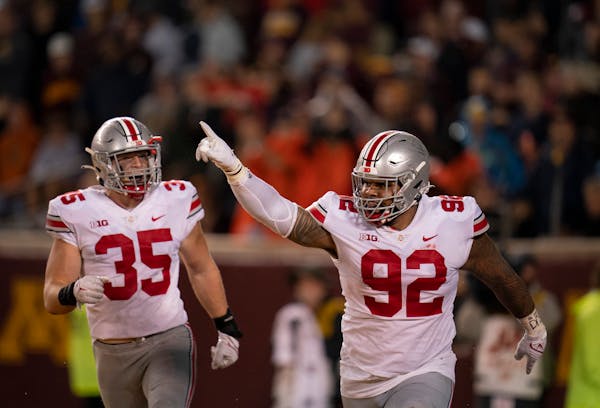 Ohio State’s Haskell Garrett (92) celebrated Thursday after his touchdown on a fumble by Gophers QB Tanner Morgan.