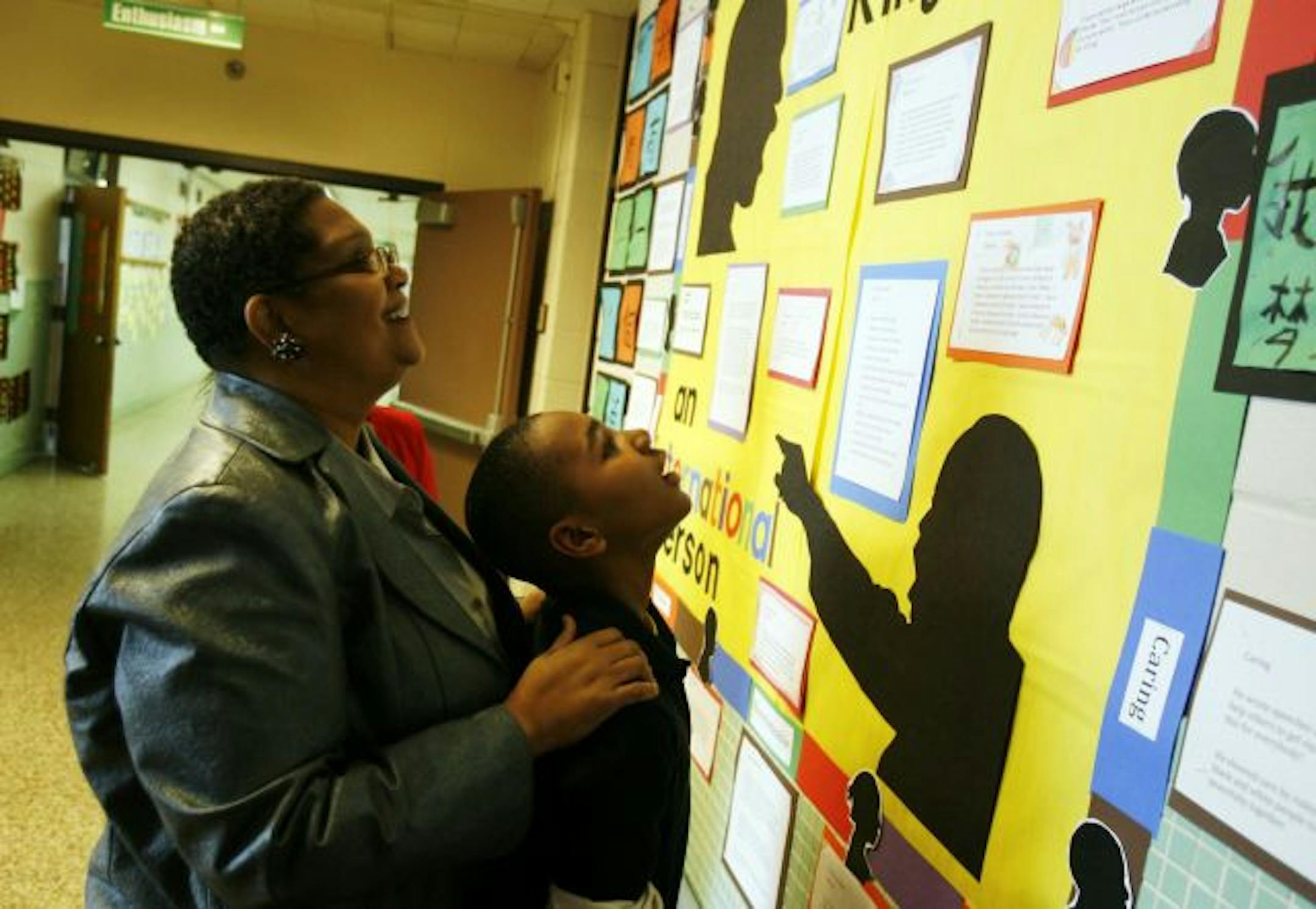 Bernadeia Johnson spent some time at Hall Elementary School, where she served as principal until 2004, looking at a board dedicated to the Rev. Martin Luther King Jr. that was created by Antonio Maddox, 11, and some of his fifth-grade classmates.