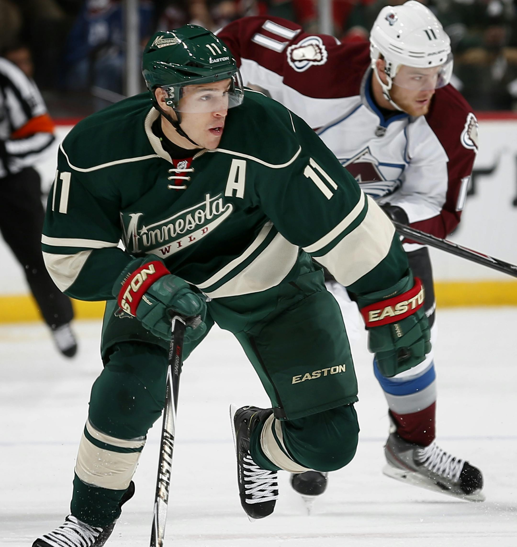 Zach Parise (11) skated up the ice in the first period. ] CARLOS GONZALEZ cgonzalez@startribune.com - October 9, 2014 , St. Paul, Minn., Xcel Energy Center, NHL, Minnesota Wild vs. Colorado Avalanche Season opener ORG XMIT: MIN1410092109454834