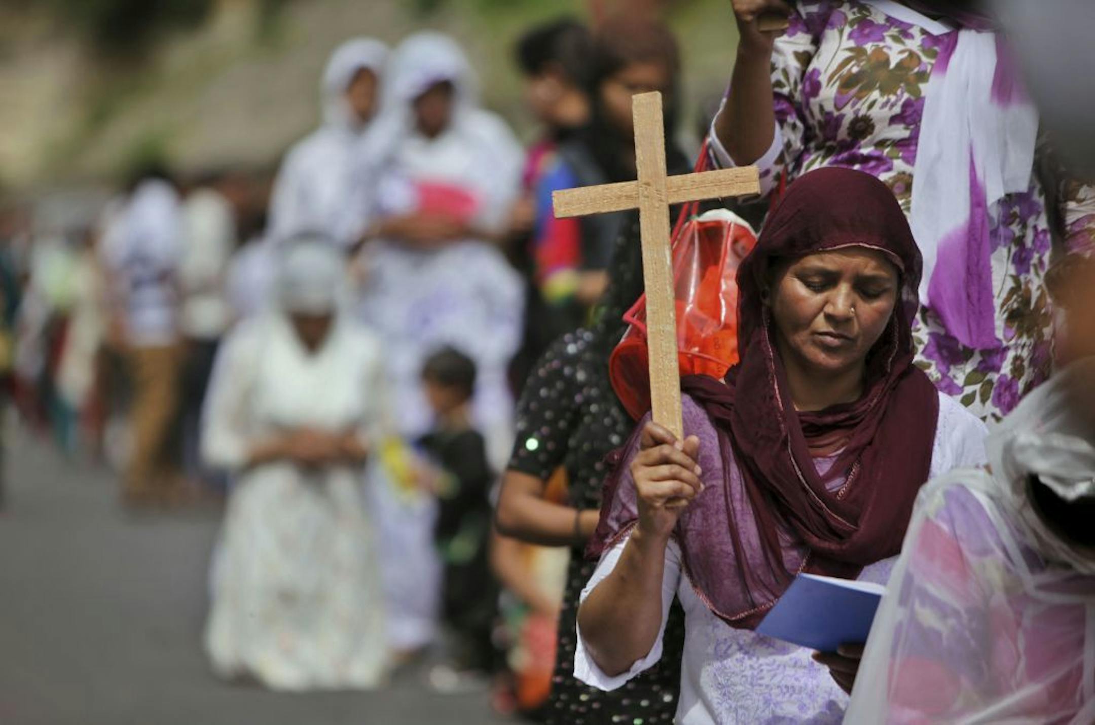 Indian Christian devotees pray on Good Friday in Jammu, India, Friday, March 29, 2013. Christians all over the world are marking Good Friday, the day when Jesus Christ was crucified.