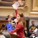 Minneapolis resident Colleen Kepler, who is against the 2040 plan in its current form, holds mail she has received from the city, complaining that the