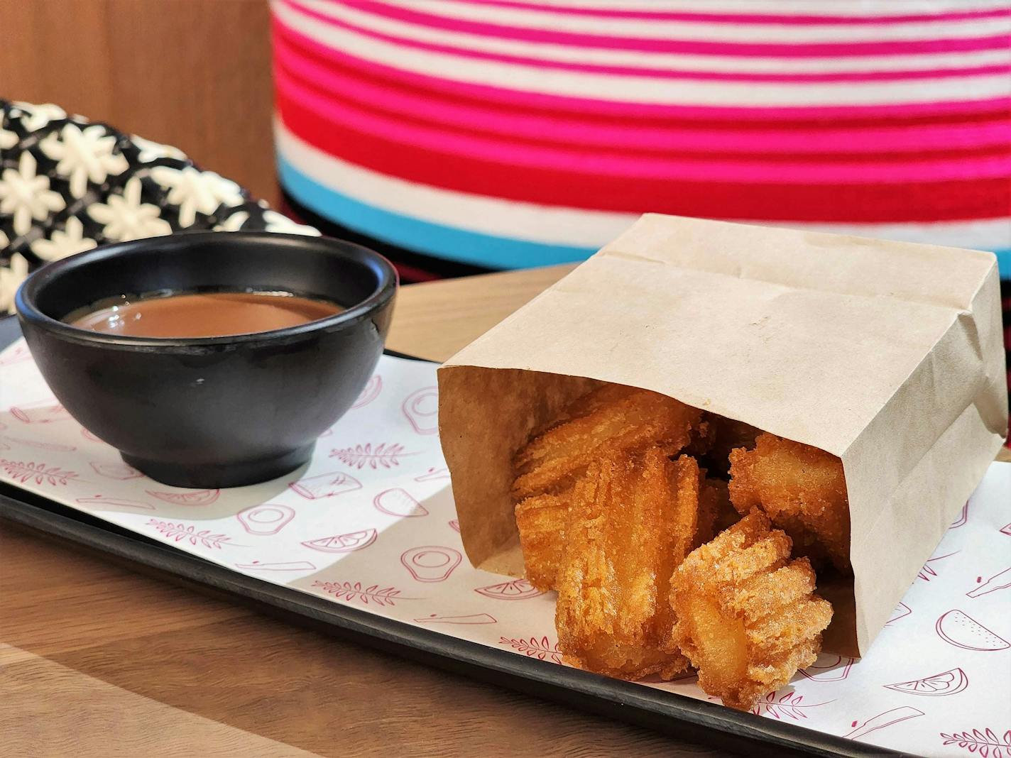 Mini churros with chocolate dipping sauce at Puralima Cantina in Minneapolis