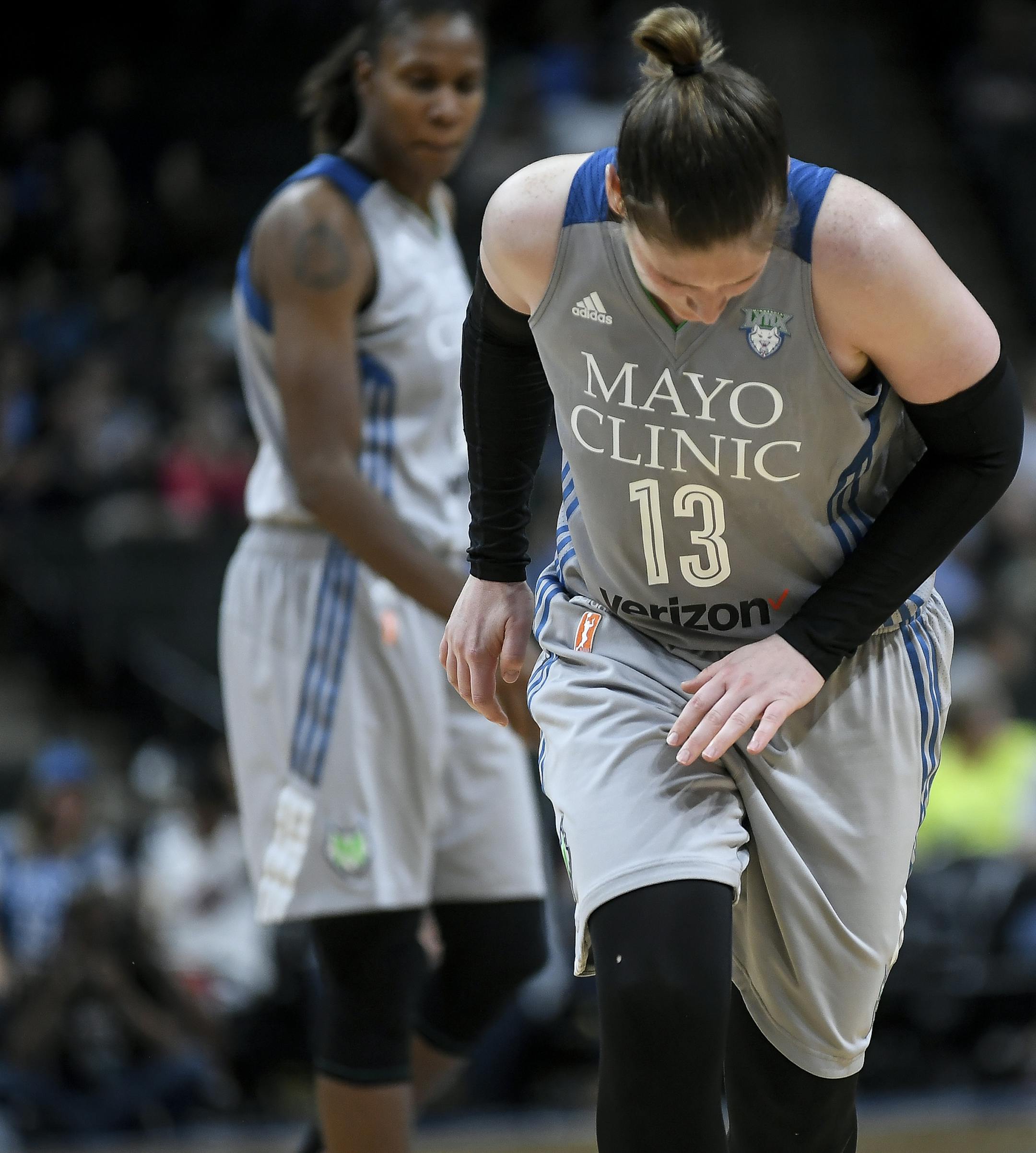 Minnesota Lynx guard Lindsay Whalen (13) winces in pain after injuring her left hand during the third quarter against the Atlanta Dream in a WNBA basketball game Thursday, Aug. 3, 2017, in St. Paul, Minn. The Lynx won 69-54. (Aaron Lavinsky/Star Tribune via AP)