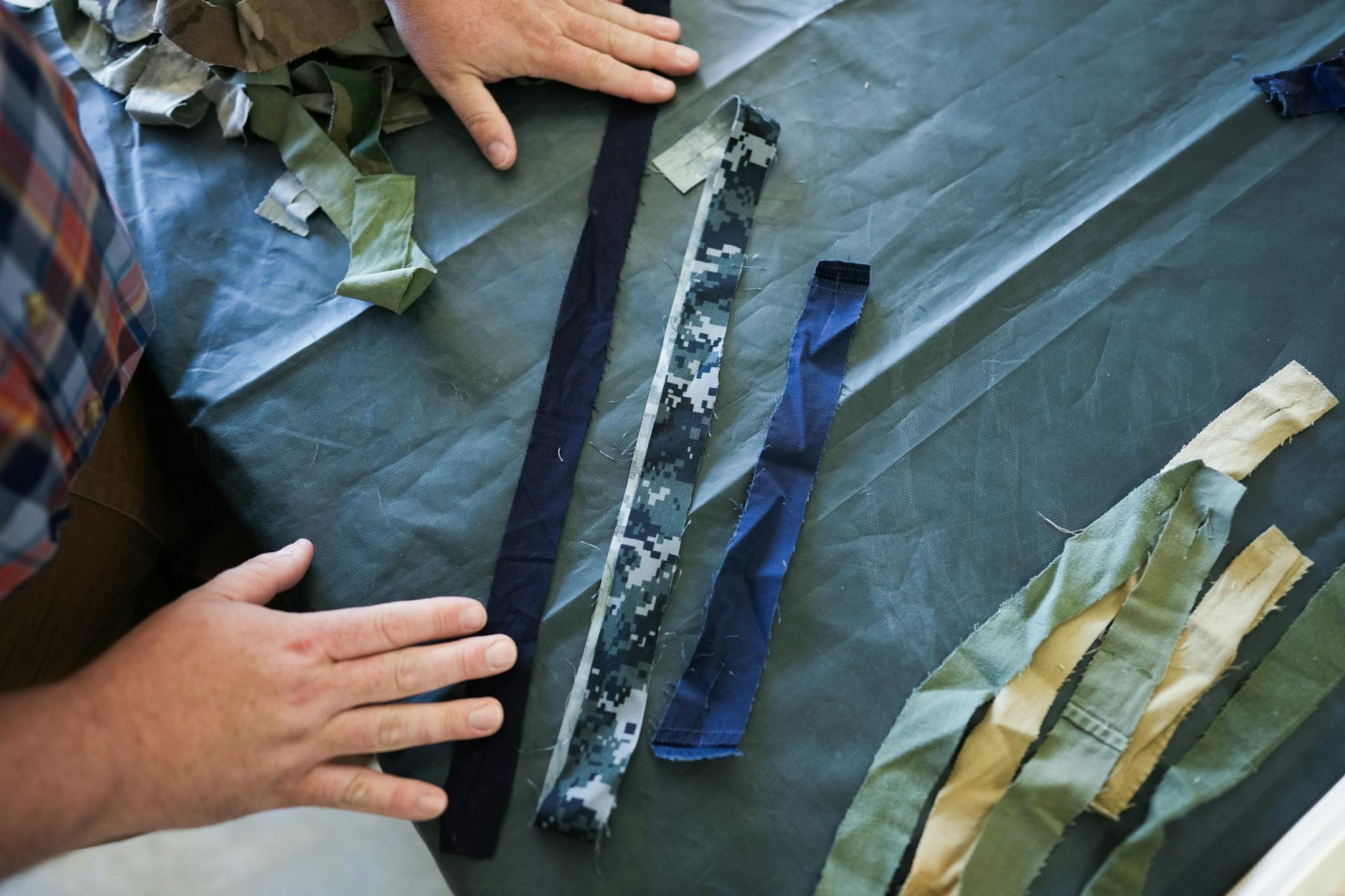 Army veteran and artist Jeffrey Stenbom demonstrated how he weaves American flags using old service member uniforms.
