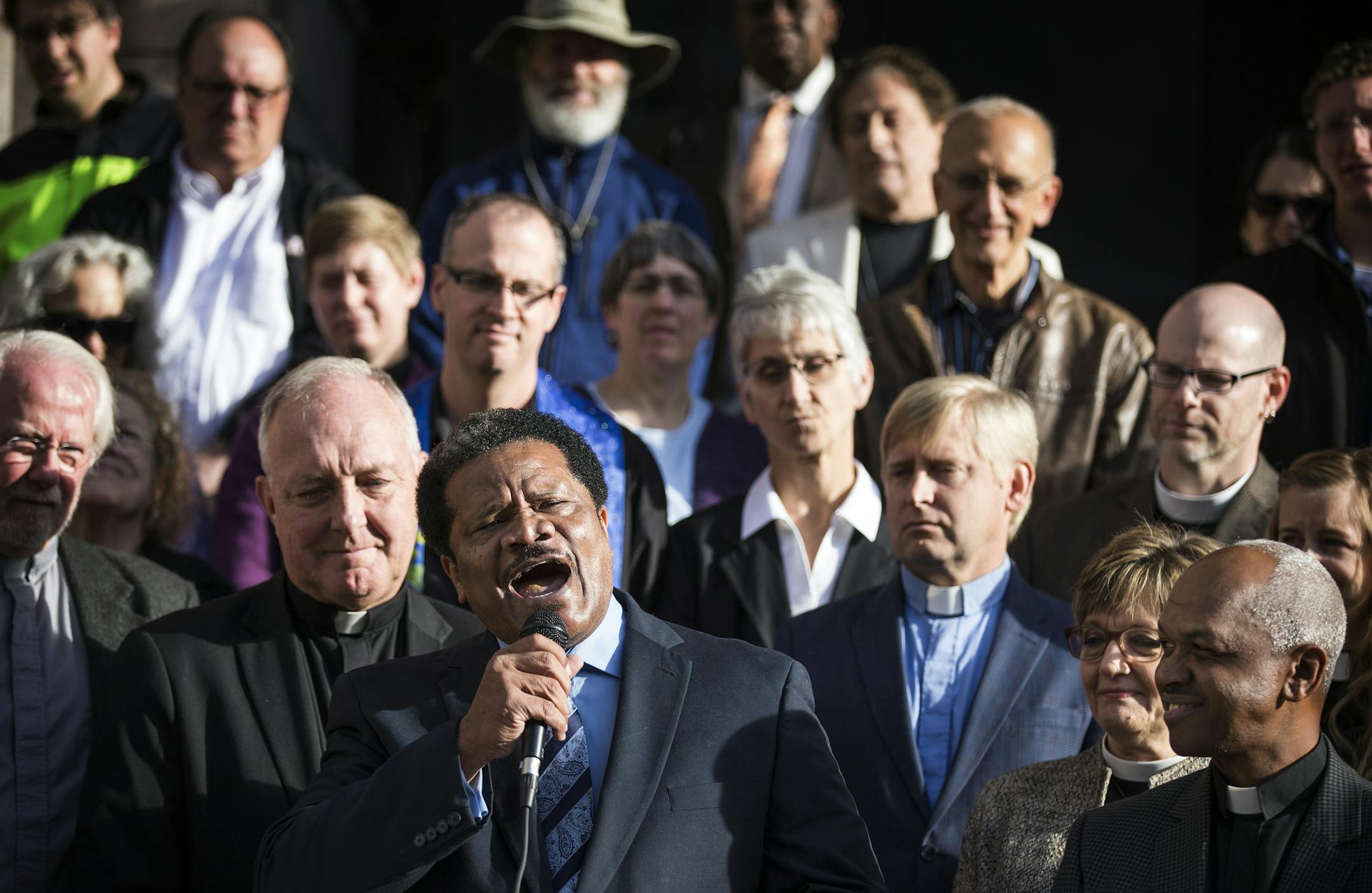 Rev. Dr. Billy Russell of Greater Friendship Baptist Church in Minneapolis speaks in support of the proposed sick-leave ordinance outside City Hall in Minneapolis on Thursday, October 22, 2015. ] (LEILA NAVIDI/STAR TRIBUNE) leila.navidi@startribune.com BACKGROUND INFORMATION: Religious leaders gathered at Minneapolis City Hall to demonstrate their support for the proposed sick-leave ordinance, which would require businesses in Minneapolis to give all of their workers paid sick leave and set all
