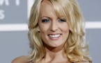 FILE - In this Feb. 11, 2007 file photo, Stormy Daniels arrives for the 49th Annual Grammy Awards in Los Angeles.