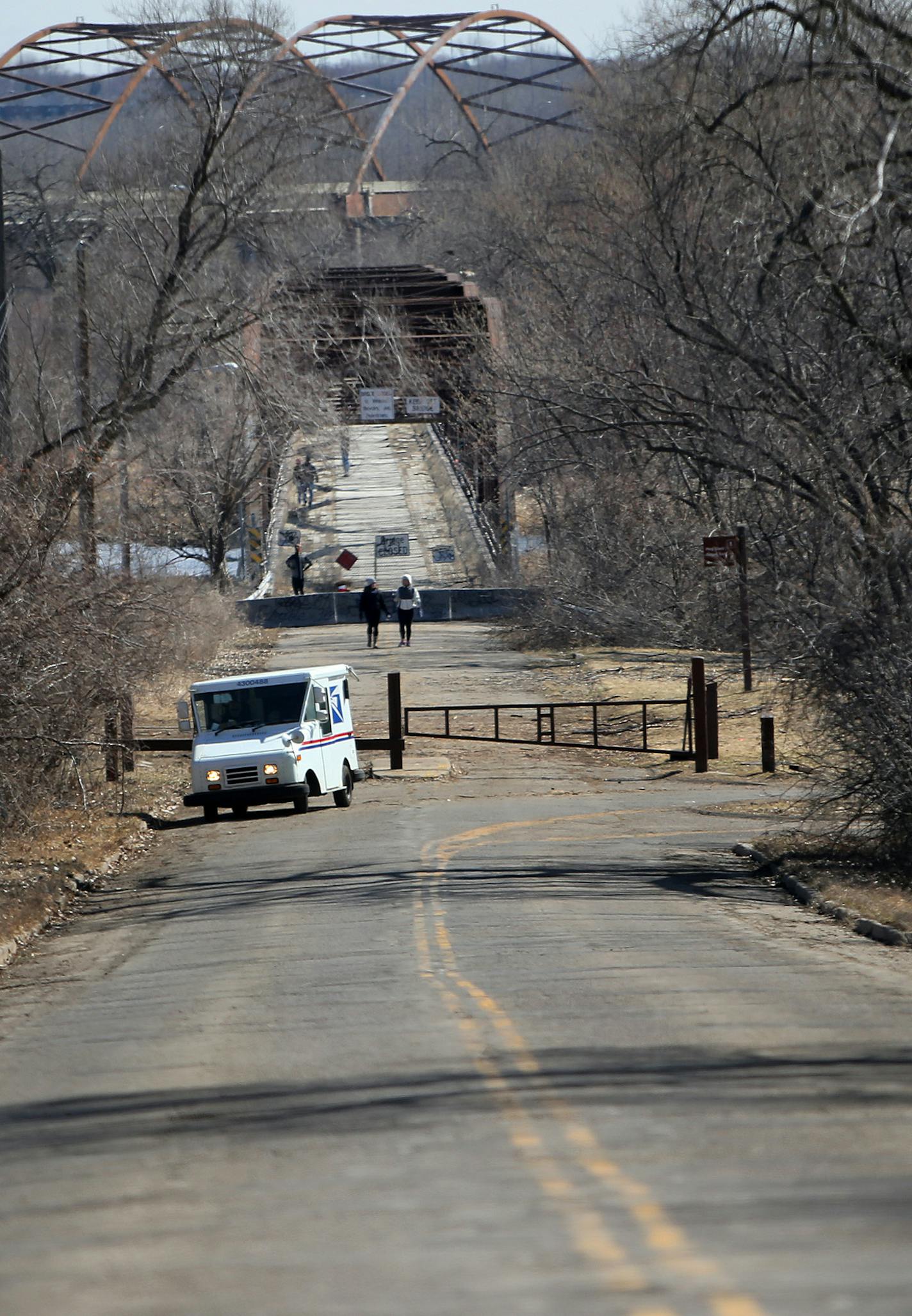 Residents of Old Cedar Avenue call it "the road Bloomington forgot." Until recently, now that the Old Cedar Avenue Bridge is going to be renovated for walkers and bikers, the city is going to also to rebuild the road with assessments for residents along the road proposed between $10,000 and $40,000. Here, the poorly maintained stretch of road is seen near the Old Cedar Avenue Bridge Saturday, March 21, 2015, in Bloomington, MN.](DAVID JOLES/STARTRIBINE)djoles@startribune.com Residents of Old Ced