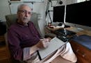 Dr. Lonny Shavelson, of Bay Area End of Life Options, looks over data at his home office in Berkeley, Calif., on Feb. 18, 2020. Shavelson is leading a
