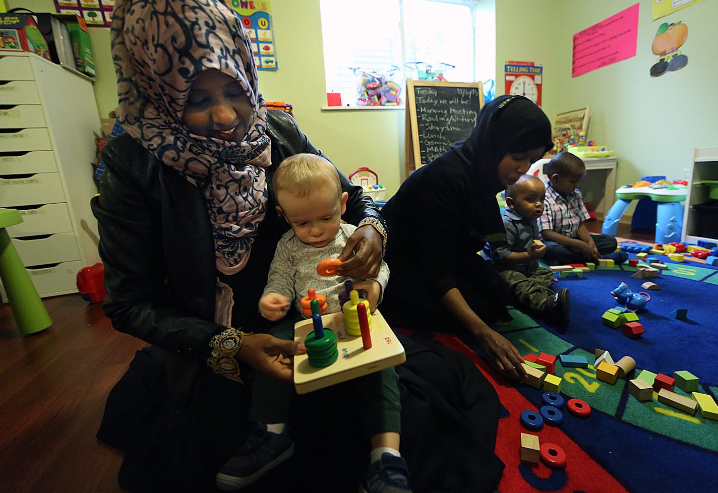 Farhia Egal and a helper worked with kids at her Richfield day care, which earned the maximum four stars from Parent Aware.